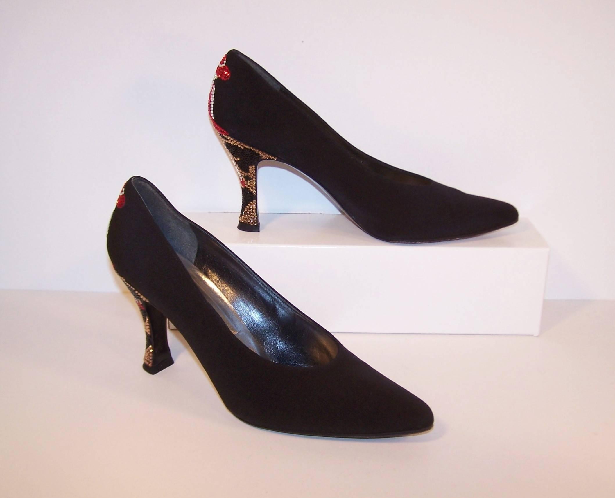 Sophistication from the front with a good dose of whimsy in the back!  These Stuart Weitzman classic black silk evening shoes are adorned with 3.5" heels decorated in pave crystals depicting glamorous red hat wearing ladies sitting atop an