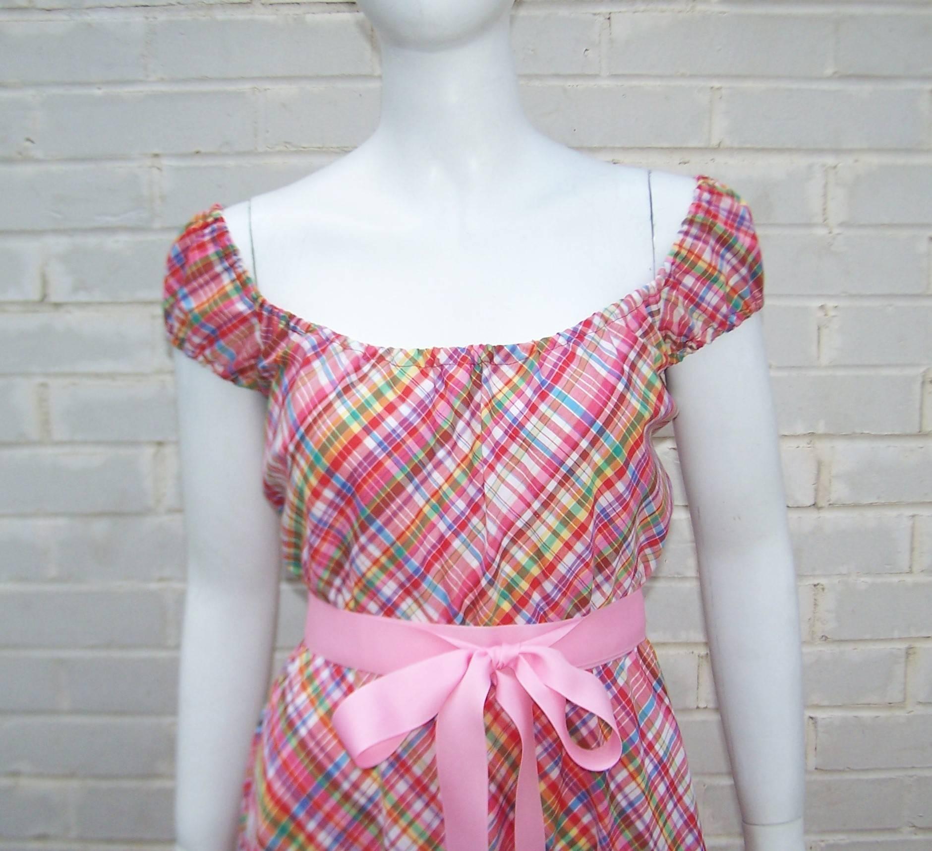 This cute 1970's Clovis Ruffin dress is light and summery with a youthful silhouette.  The dress is constructed with an easy pull on style typical of Mr. Ruffin's designs and has elasticized neckline, sleeves and waist to keep everything in place. 