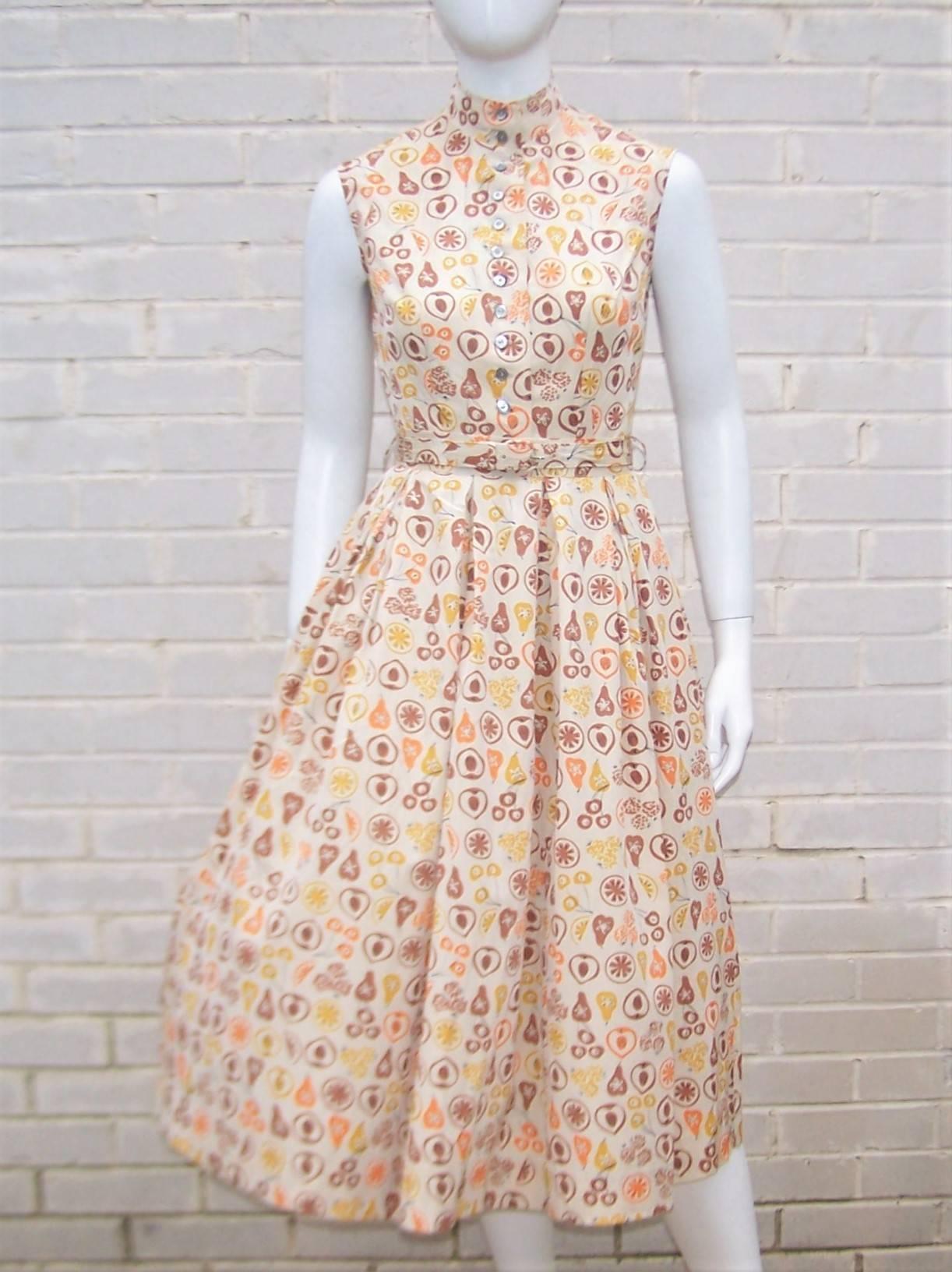 What a cutie!  It's hard to say what's more fun about this two piece dress ... the graphic cotton blend fruit print or the great structured mandarin style bodice.  Either way, Petti, the junior brand for Joan Miller, has created a classic 'neat as a