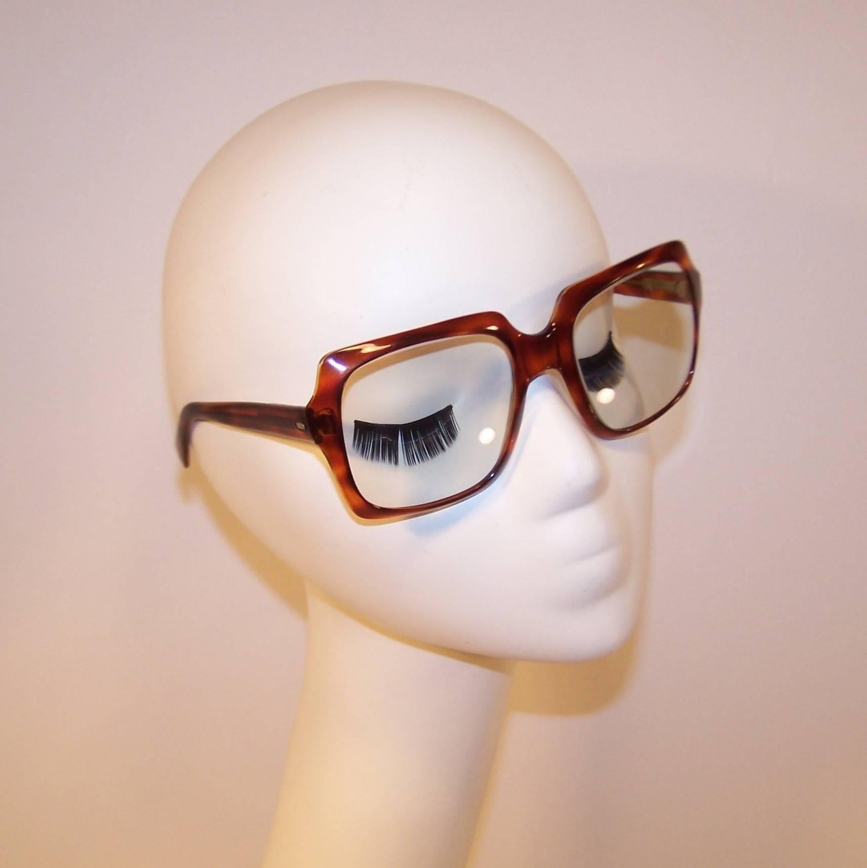 These 1970's Italian eyeglass frames make a statement ... 'I'm large and I'm in charge'.  They also speak volumes about high fashion with a wink and a nod to a fun over-the-top look that is sure to get you noticed.  The faux tortoise body is a