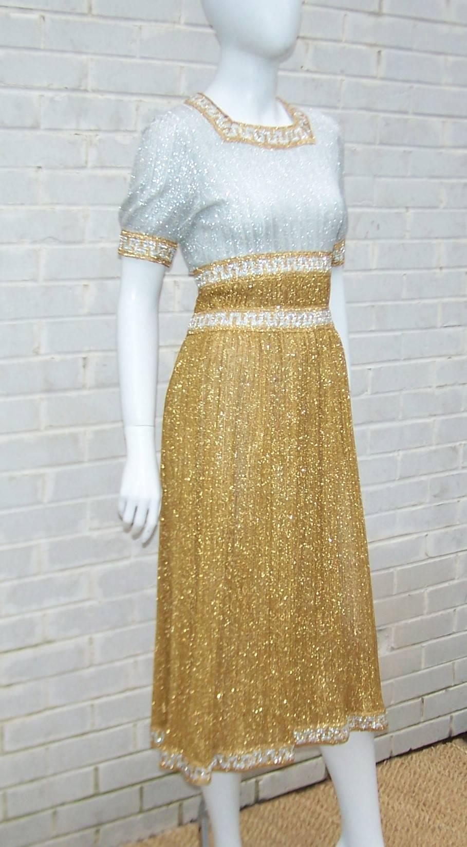 Stan Herman produced cutting edge fashion for Mr. Mort in the 1960's and this gold & silver lamé dress is a dazzling example of his work.  The dress zips and hooks at the back with a knit style fabric expertly ribbed and banded with a Greek key