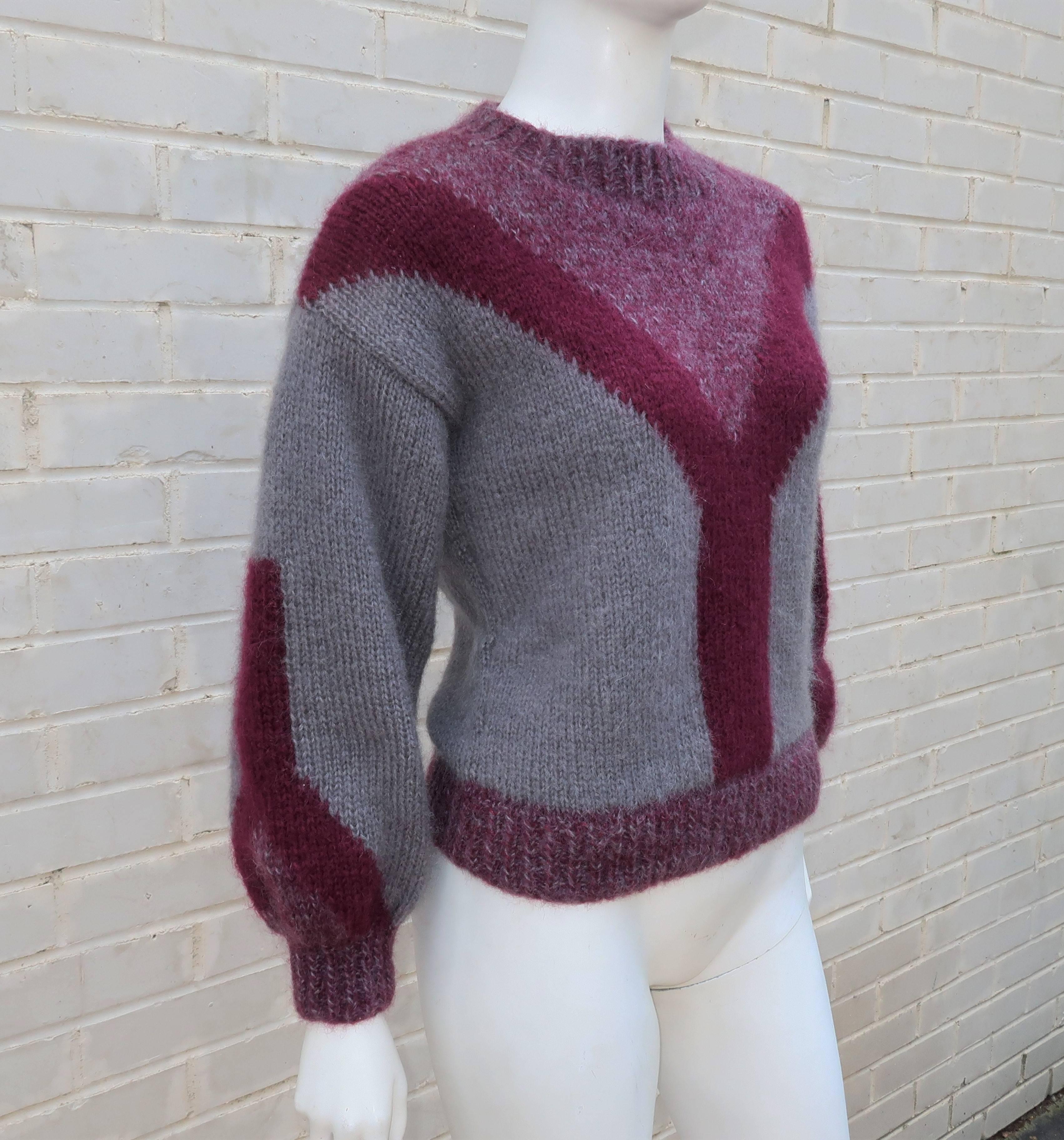 Chunky, cozy & casual!  This 1970's pullover sweater has the hallmarks of a vintage football sweater with a 'Y' shaped design created by color blocking a bluish gray and deep burgundy plum mohair wool across the front and on the sleeves.  There