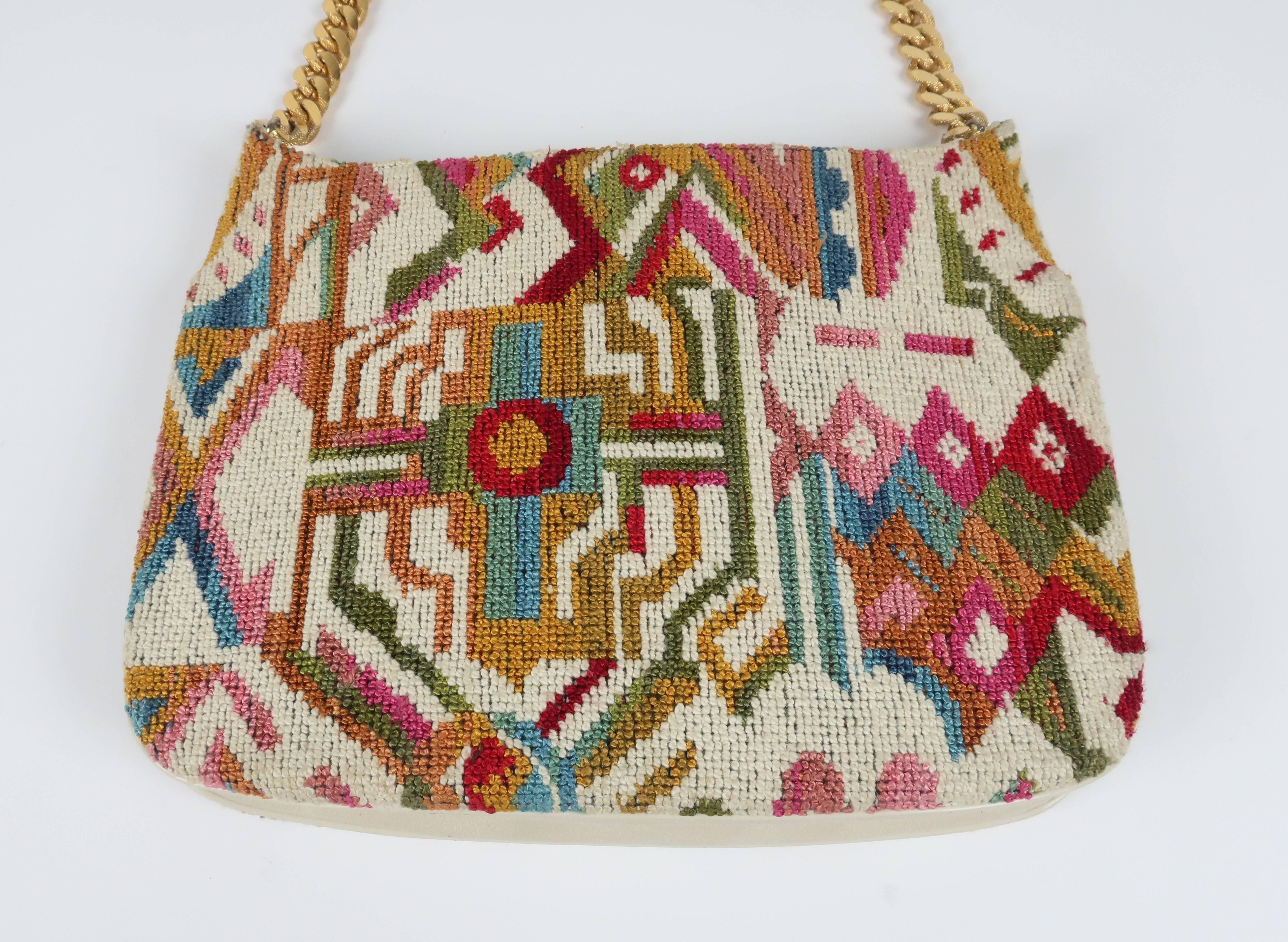 Fun and functionality!  Meyers always stayed on top of the fashion trends with well made and affordable handbags such as this C.1970 needlepoint bag with a colorful geometric design reminiscent of Navajo prints.  The texture and colors were as