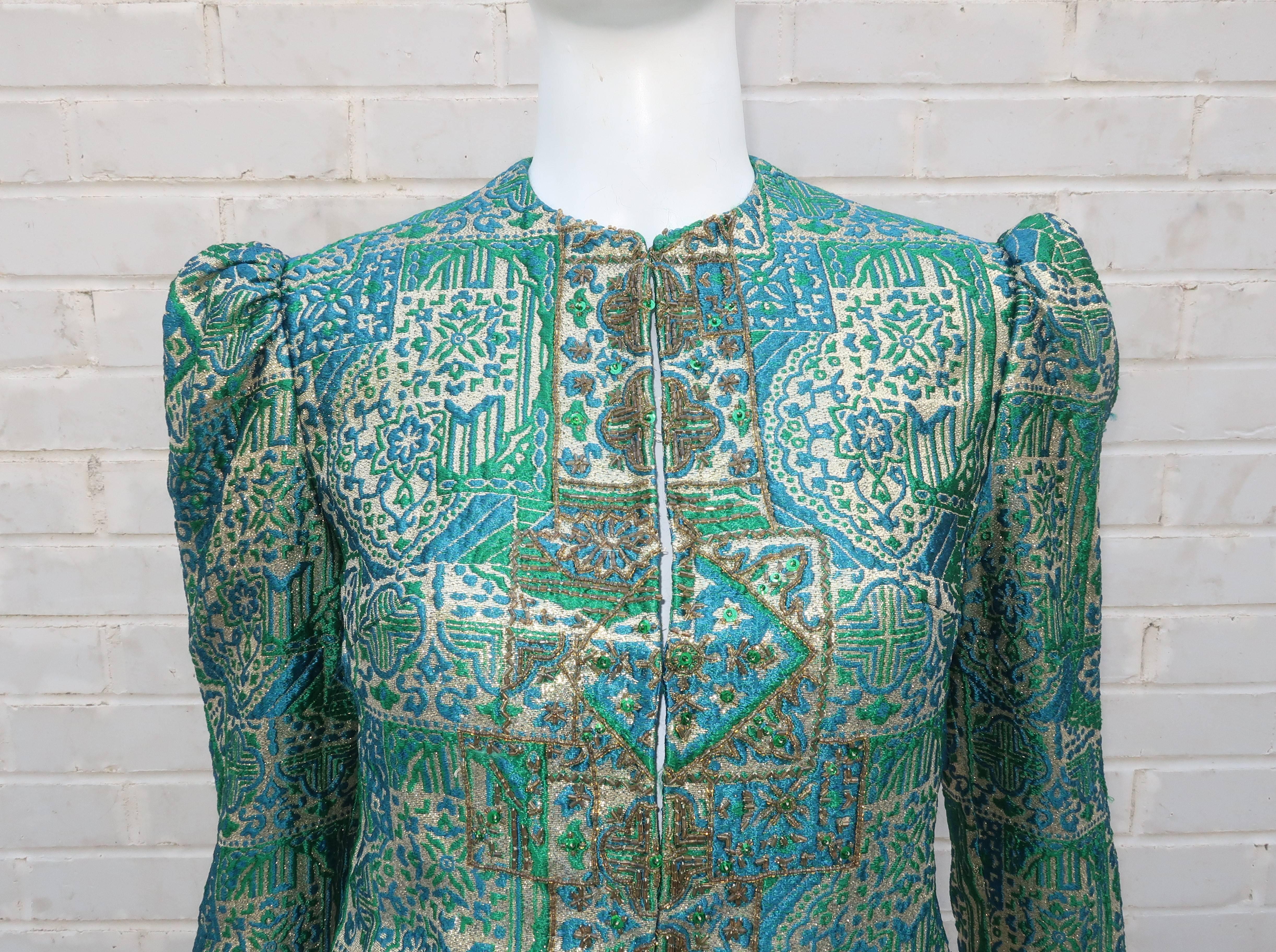 Rich & regal!  Apt descriptions for this fitted 1960's Victoria Royal evening jacket in a glorious peacock blue and jade green brocade with gold lamé threading and beaded embellishments.  The exotic Asian pattern is effectively used as a