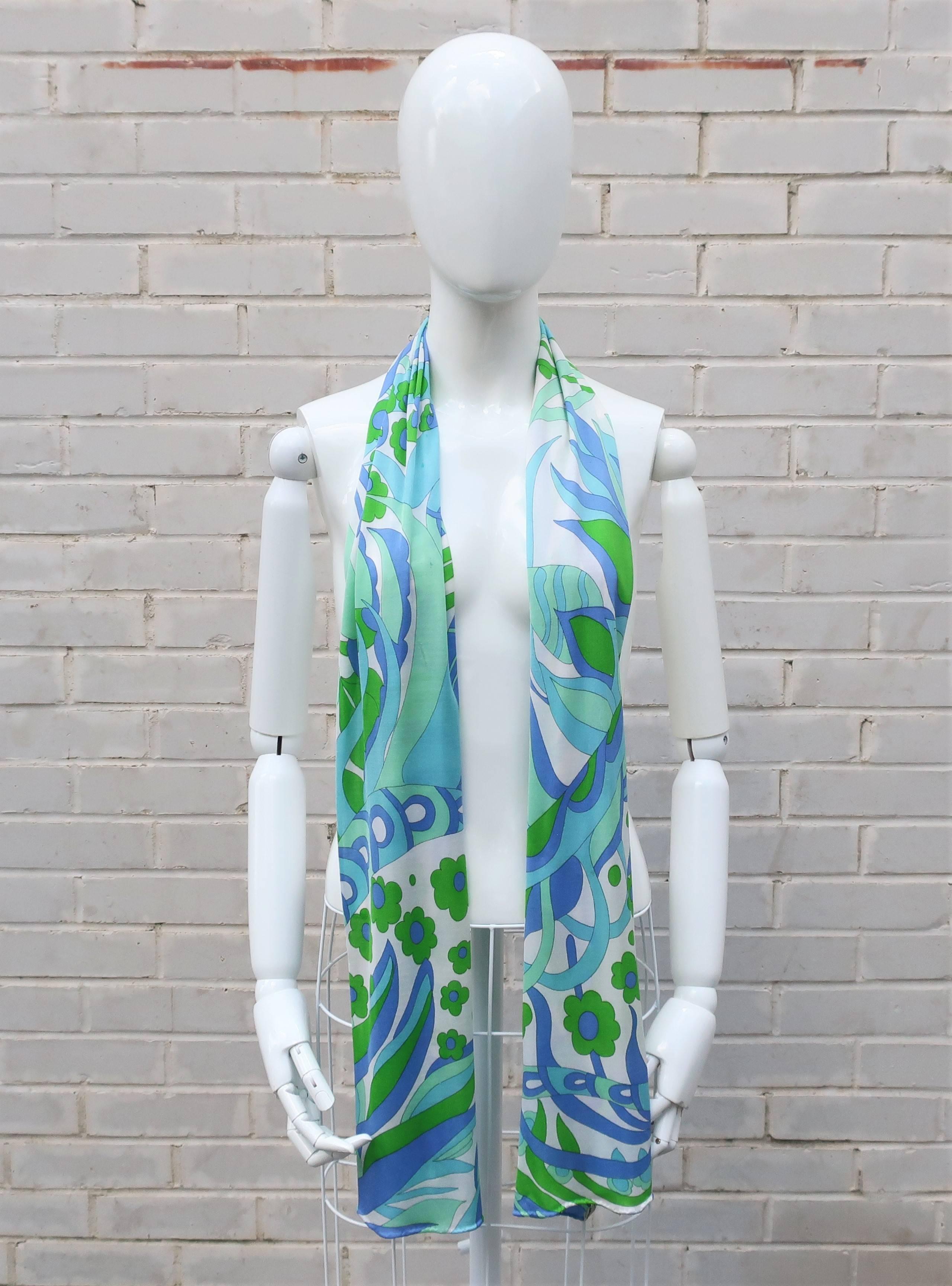 This mod silk jersey scarf was made in Italy for Bloomingdale's with a definitive nod to psychedelic Pucci prints.  The striking combination of aqua, blue, greens and white are a standout and sure to enliven any ensemble.  The slinky jersey makes it