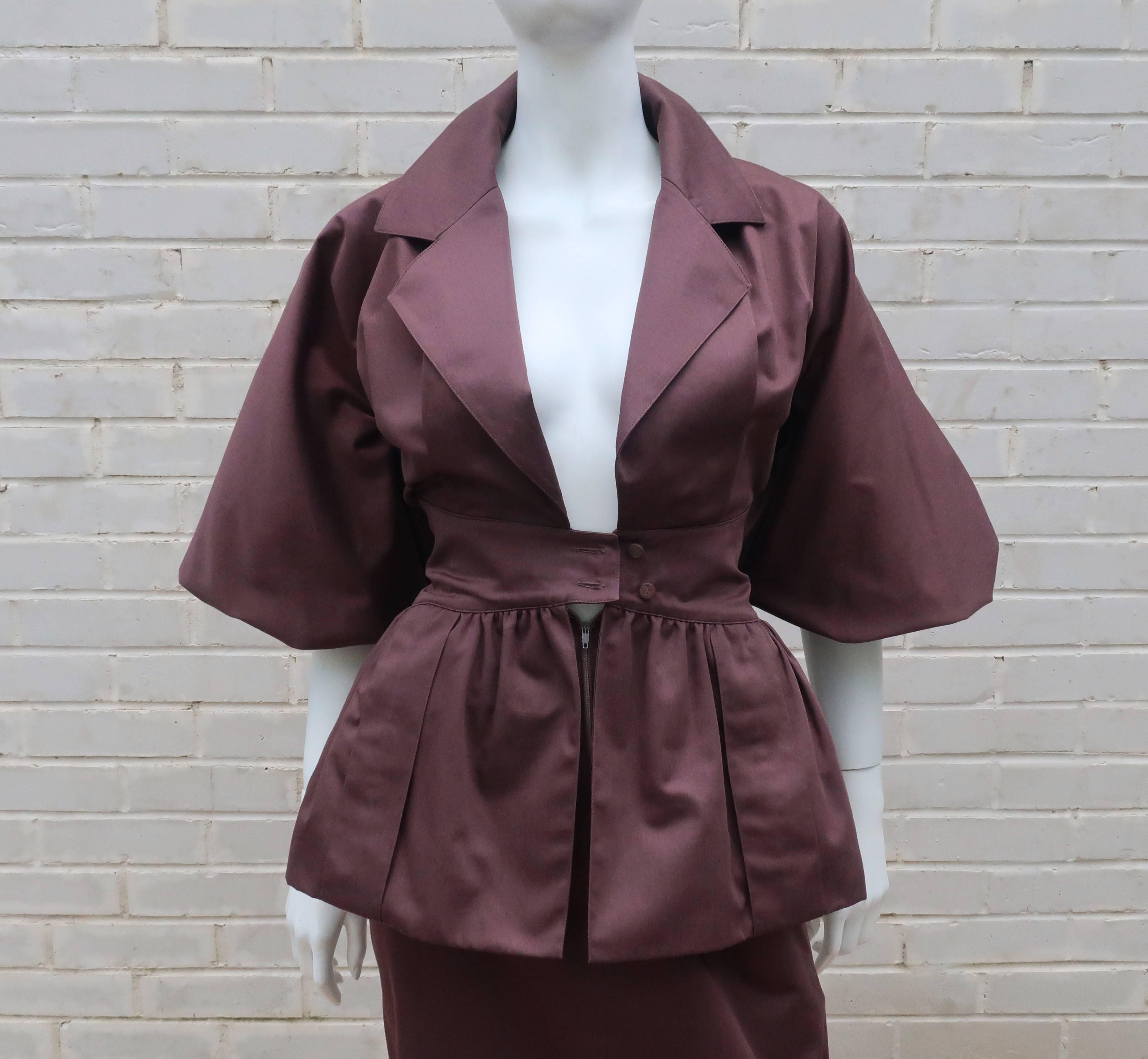 The hourglass shape of this 1980's Karl Lagerfeld silhouette is stunning.  At first glance the dress appears to be two pieces ... a peplum top and a skirt.  It's a marvelous ruse!  The one piece dress actually buttons at the waist and zips under the