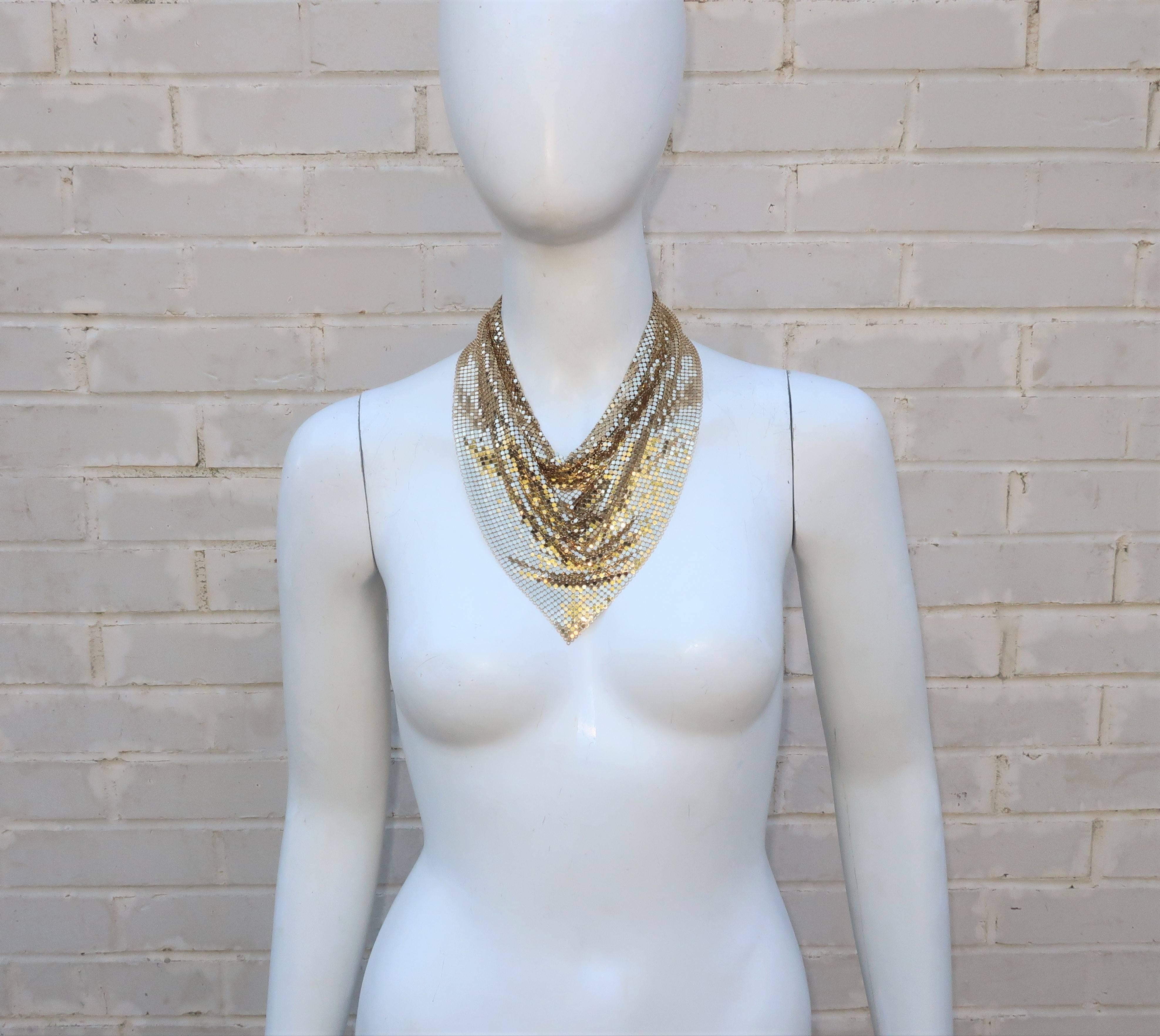 This 1970's gold chain mail bib necklace by Whiting & Davis is reminiscent of a neckerchief but instead of working the ranch ... you'll be working the disco dance floor!  The mesh 'fabric' is Whiting & Davis' signature material which harkens back to