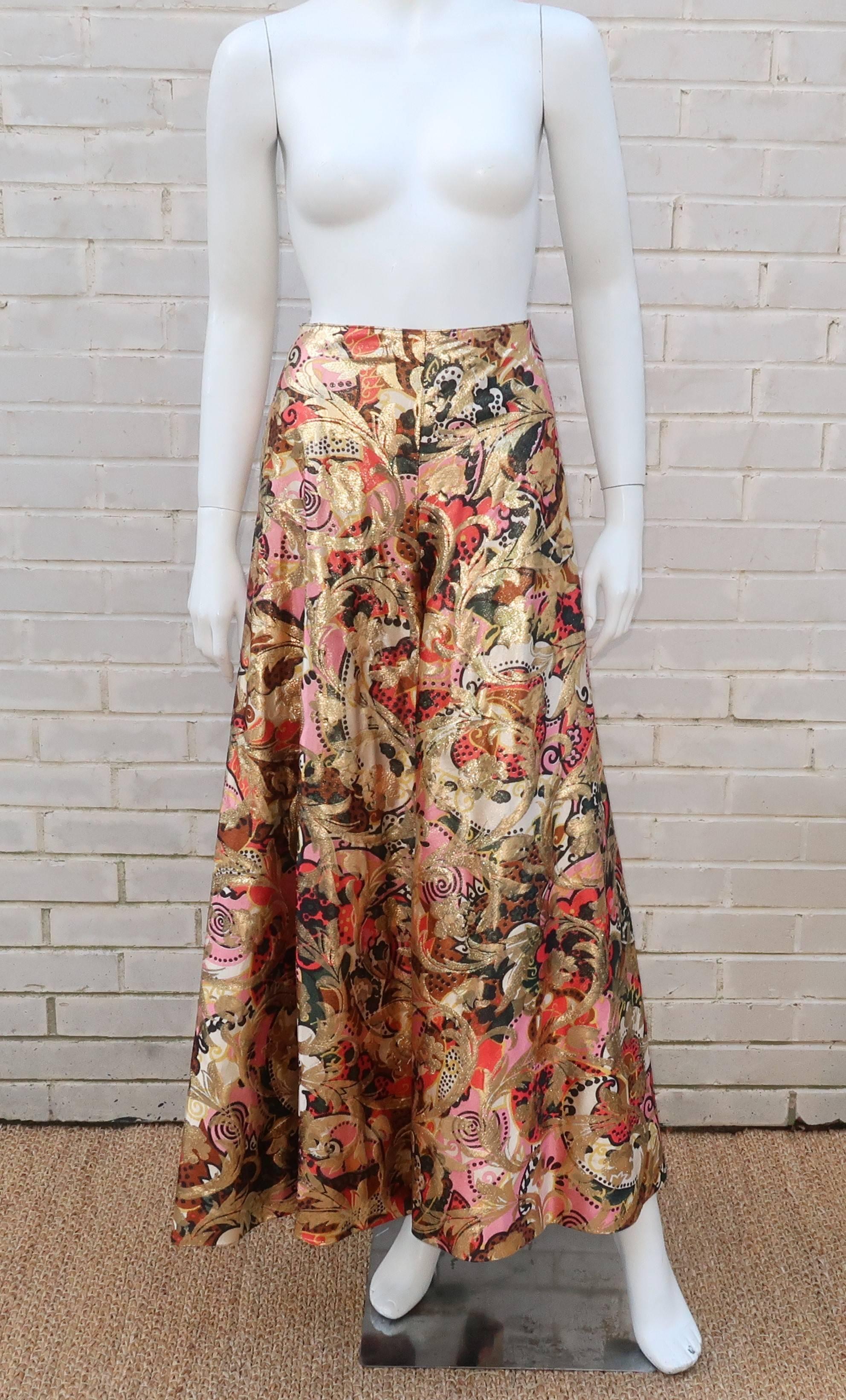 You got a party? We got the pants! These C.1970 palazzo pants are designed to perfectly display a fabulous metallic print fabric. The abstract floral design in pink, orangey red, copper, black and gold lamé combine both a mod aesthetic and art deco