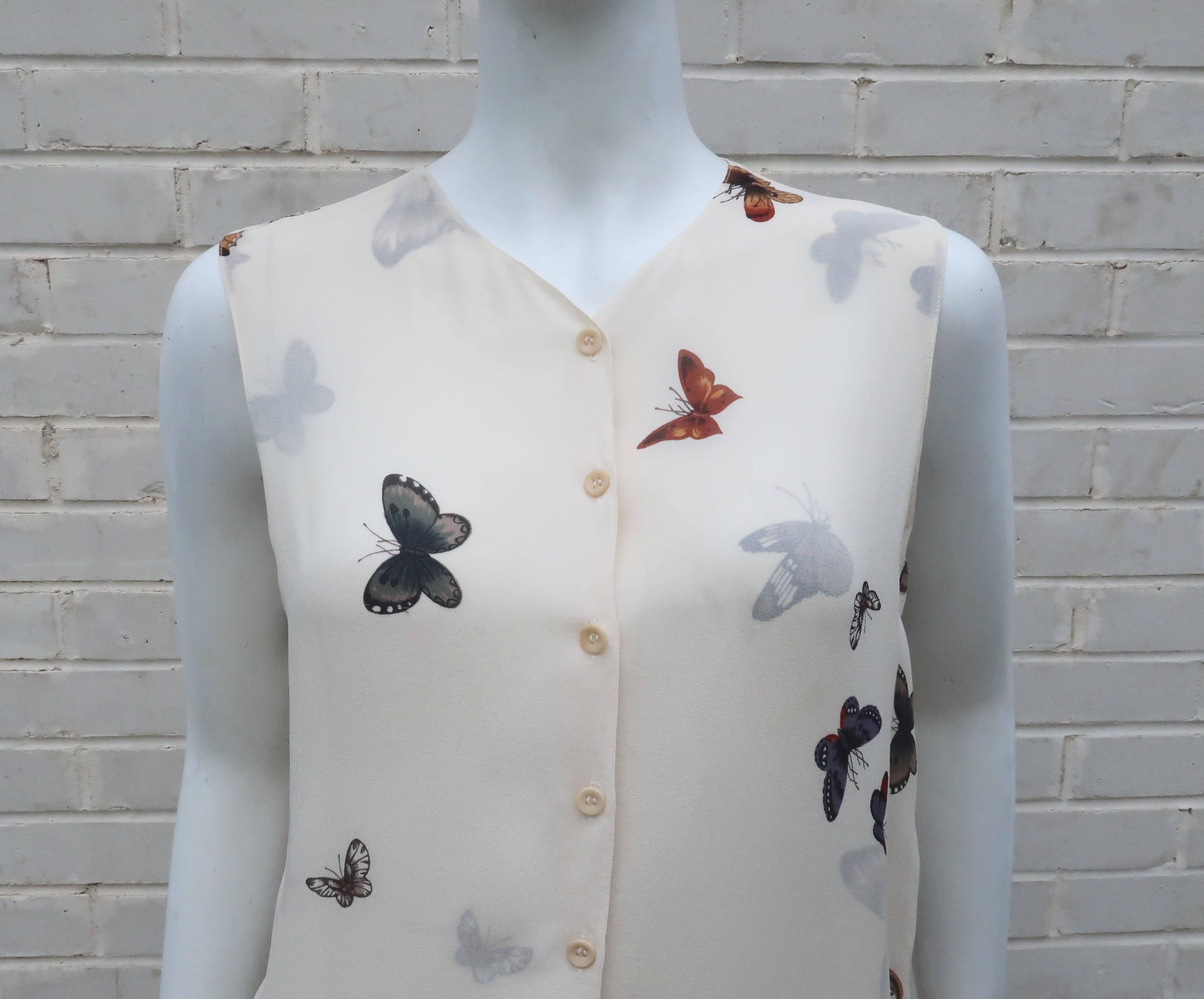 Emanuel Ungaro was known for using soft and fluid fabrics.  This wispy silk chiffon top fits that mold.  The double layer of chiffon creates a beautiful visage of butterflies and moths swirling across the exterior and interior for an interesting 3-D