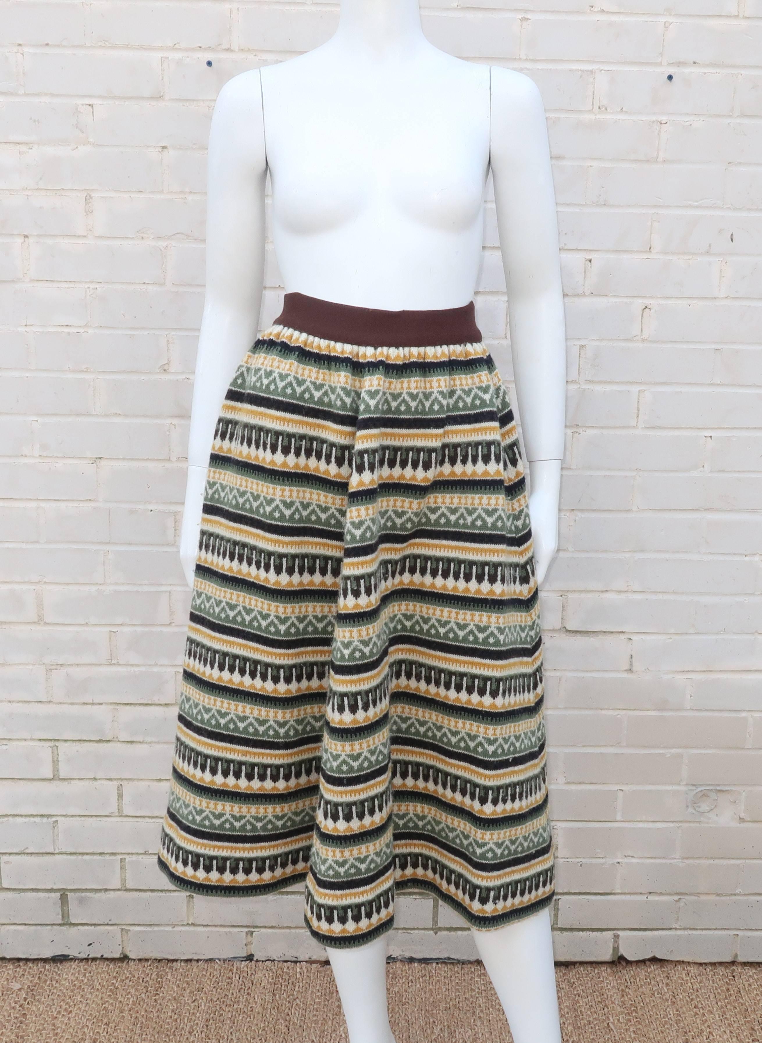 Wearing a sweater around your waist has never been so fun!  This wool knit circular skirt from Jersey Modeller of Sweden has Scandinavian sensibilities in the form of folkloric graphics and unique mid century style.  The skirt buttons and zips at