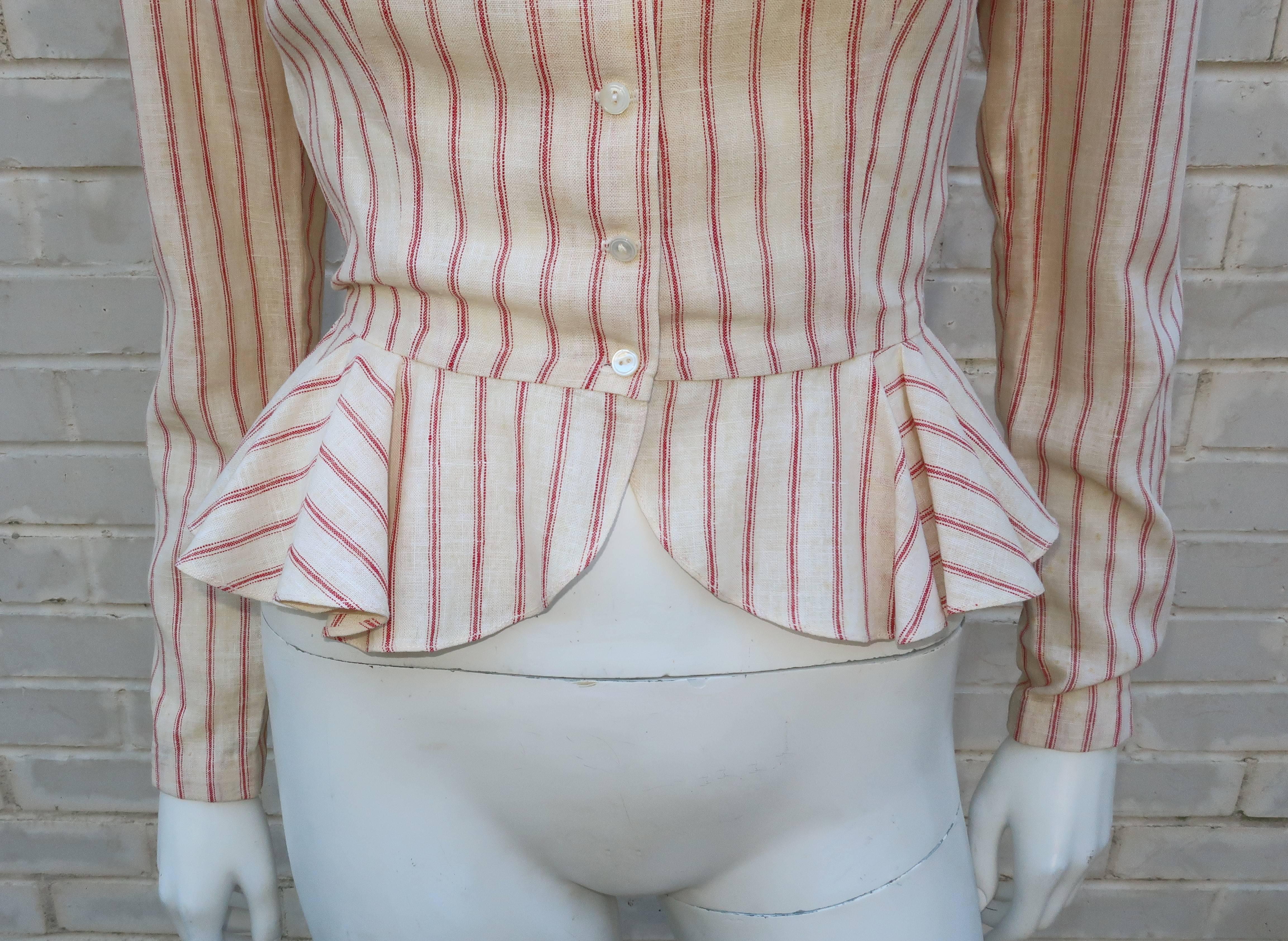 Ralph Lauren's interpretation of American Victorian styles never gets old.  This 1970's red pinstriped linen top has a decidedly feminine peplum silhouette though there is also a menswear element to the design.  The fabric is reminiscent of ticking