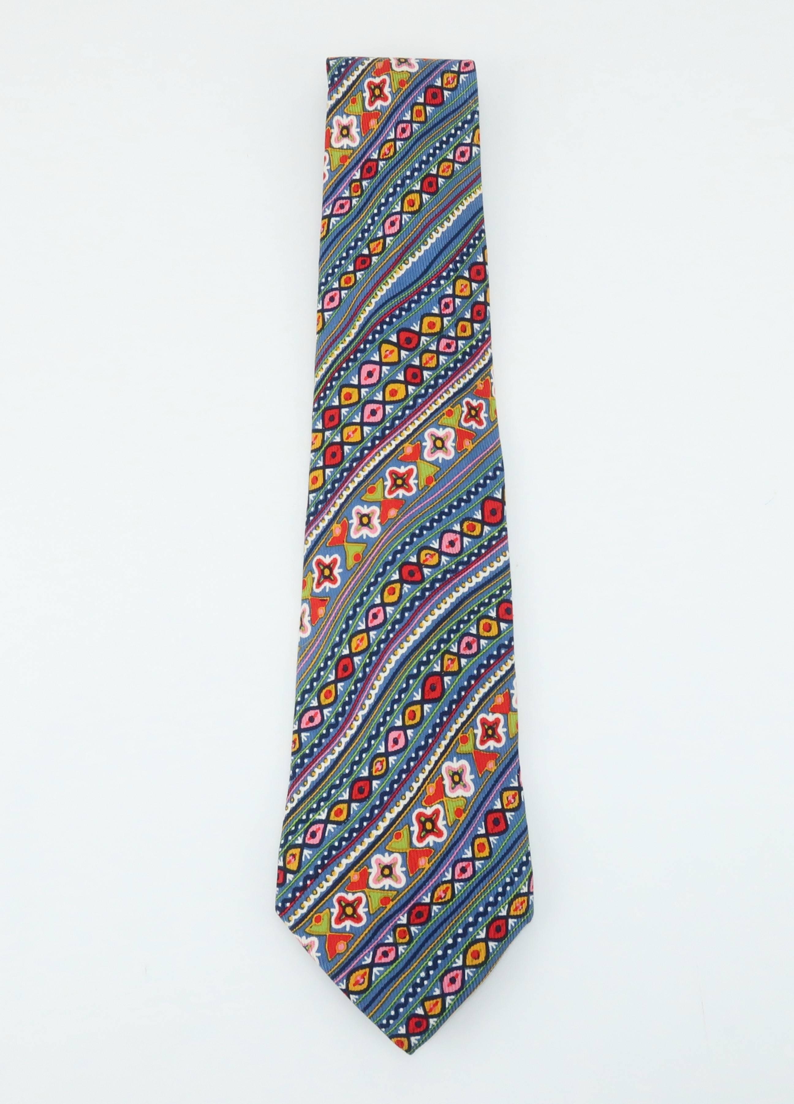 Christian Lacroix, the king of 1980's flamboyant designs, sheds some light (and a lot of pizazz) on men's necktie fashions with this colorful silk tie.  The diagonal stripe has a mod aesthetic reminiscent of earlier eras with the hint of a floral