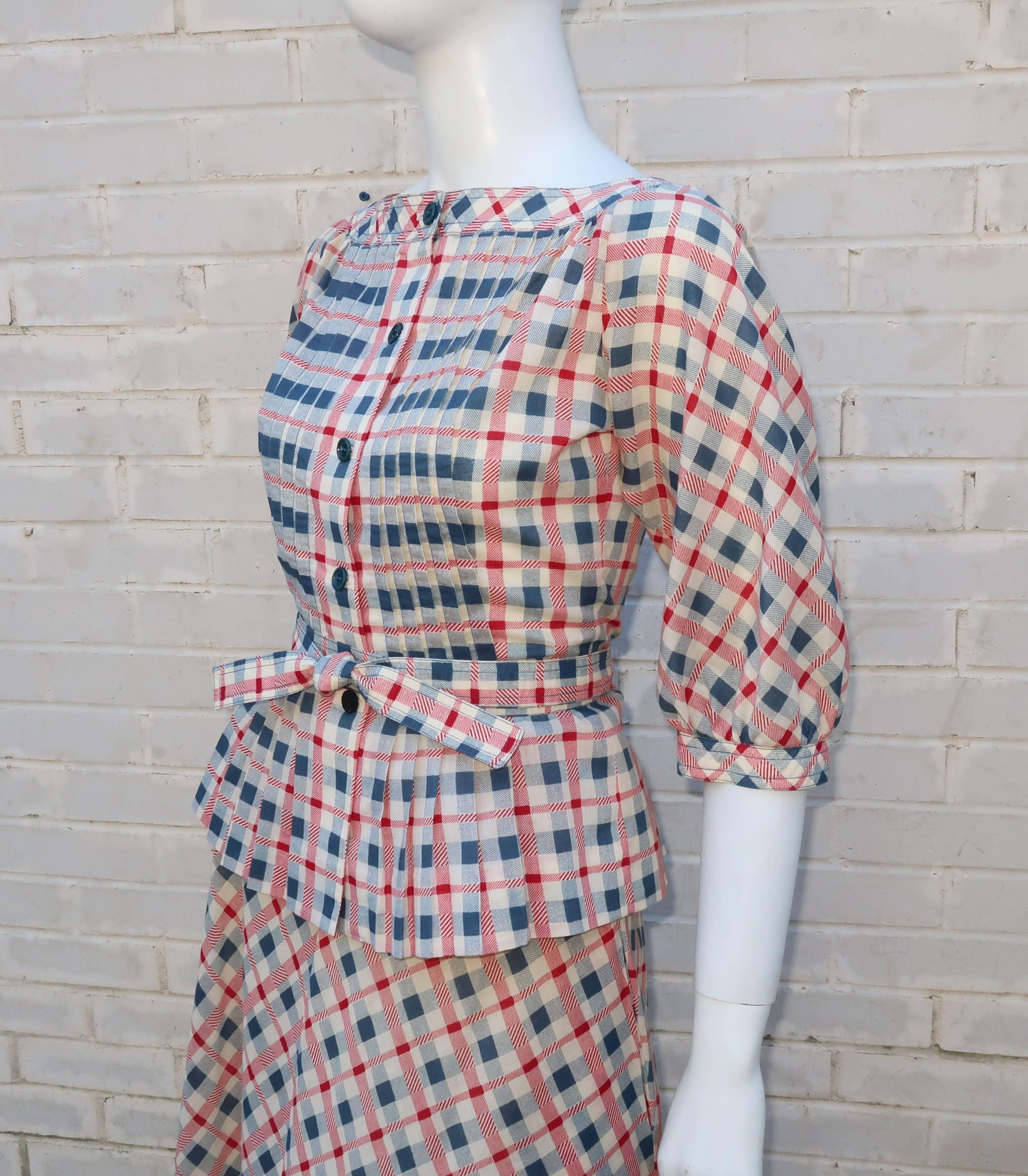 This girlish red, natural white and blue gingham plaid two piece dress set by Albert & Pearl Nipon is loaded with lovely details typical of the Albert Nipon label.  The top has an old fashioned aesthetic reminiscent of Victorian prairie fashions