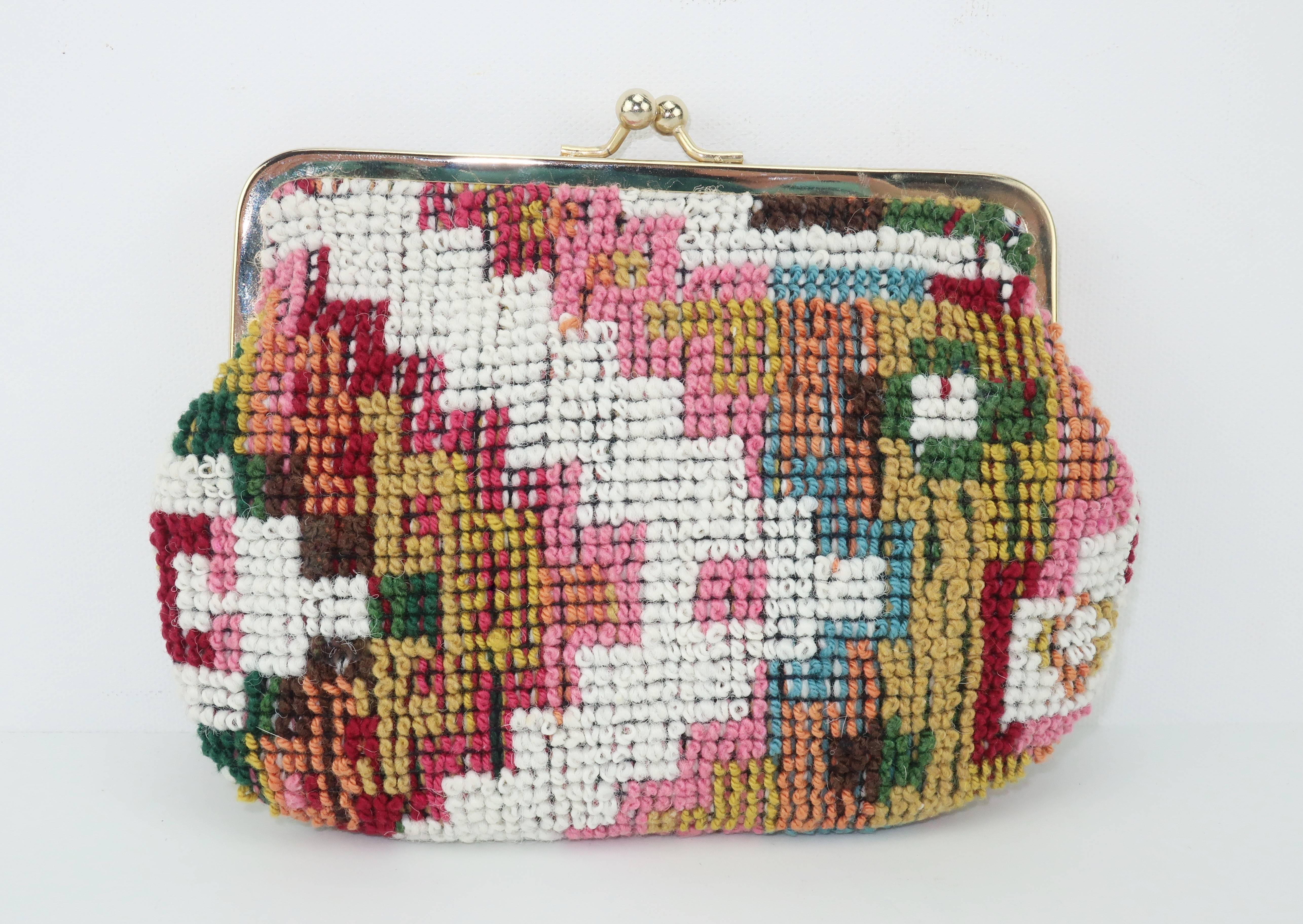 Carry your cosmetics in carpetbag style with this colorful Italian make-up bag in textural looped fabric.  The kiss lock closure opens to reveal a cleanable vinyl lined interior perfect for make-up storage.  The carpetbag design is reminiscent of a