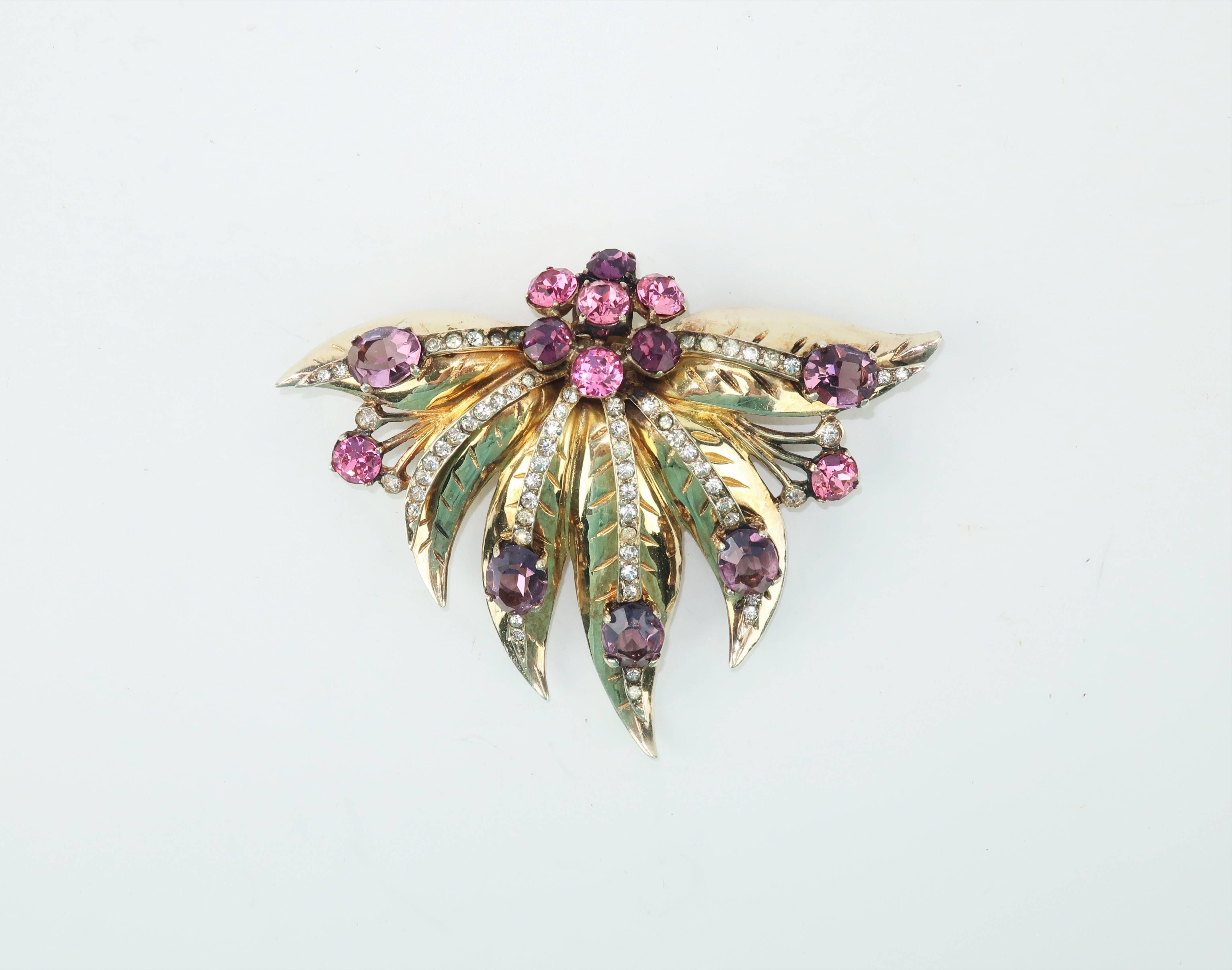 Eisenberg originally produced jewelry to accessorize their clothing line and though their fashions were popular, the brilliant pieces of costume jewelry were the real showstoppers. This C.1940 fur clip brooch is made with all the refined details of