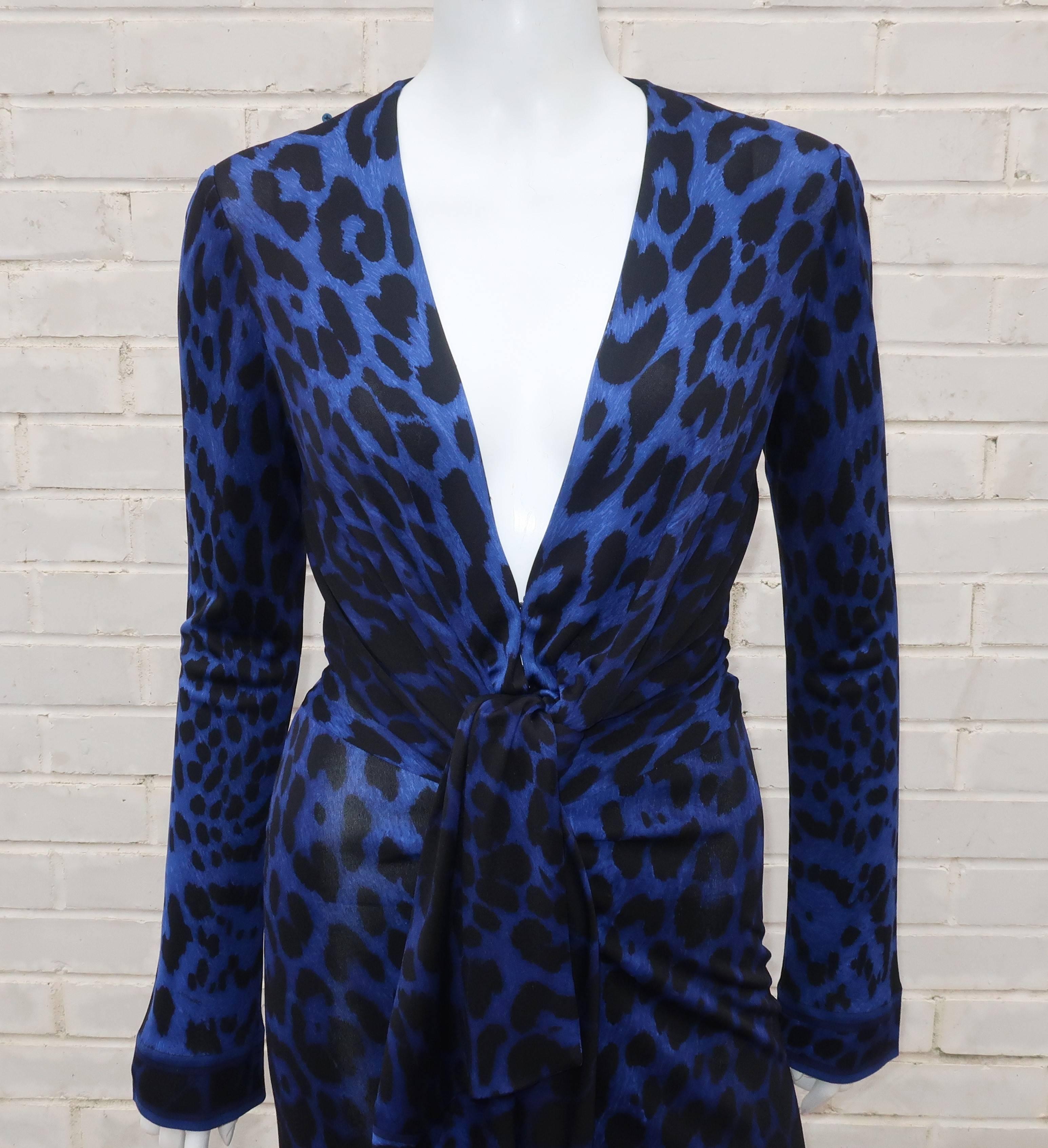 Wowza!  This fabulous Leonard silk jersey dress will bring out your inner wild child with a black and electric blue animal print.  The slinky silhouette with a plunging neckline is reminiscent of Studio 54 disco era designs ... picture Amy Adams in