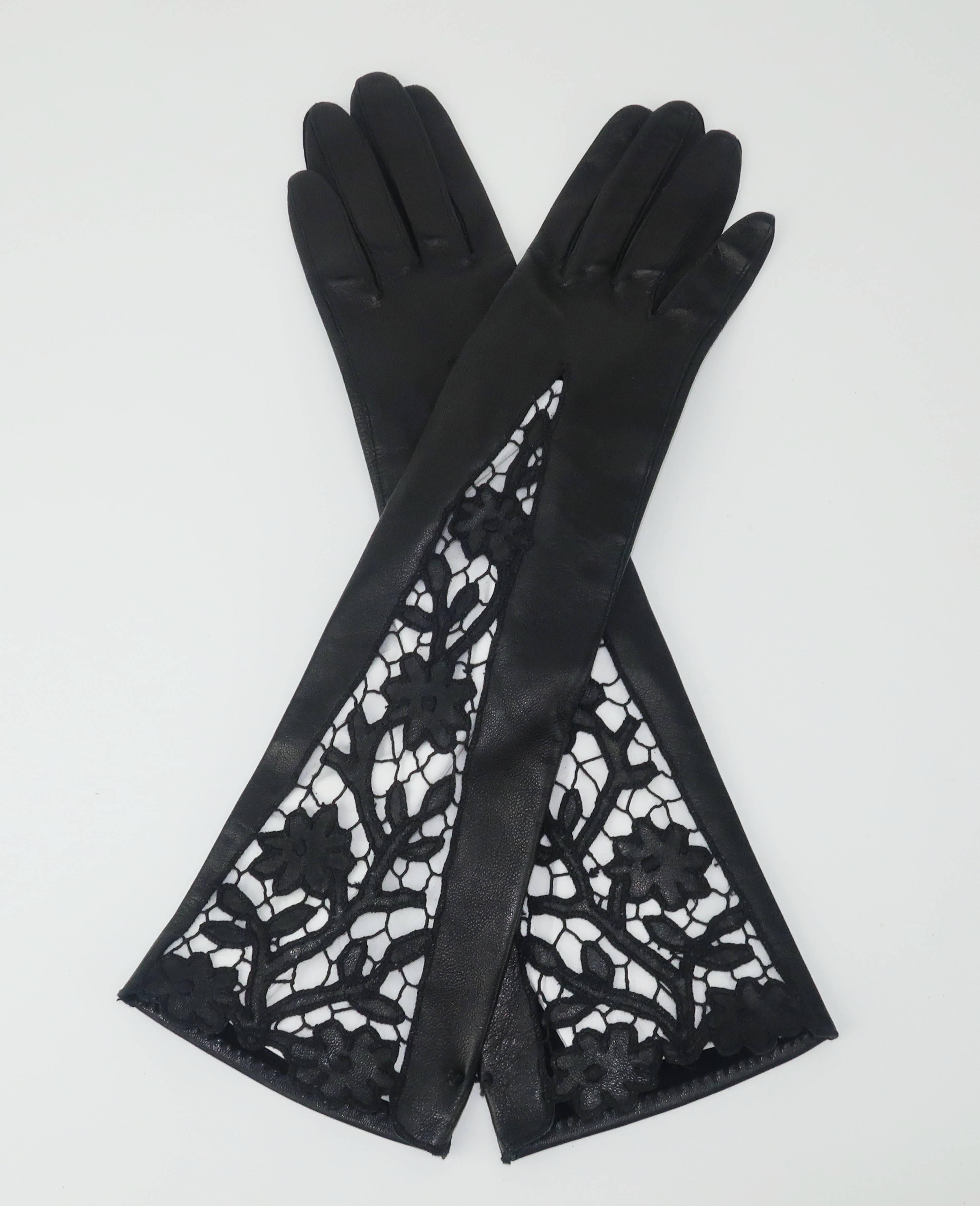 A beautiful pair of gloves is the ultimate in glamour and style. These black leather gloves are 3/4 length with intricate embroidered cut work at the cuff. Imagine pairing them with your favorite winter coat or a fabulous cocktail ensemble. 