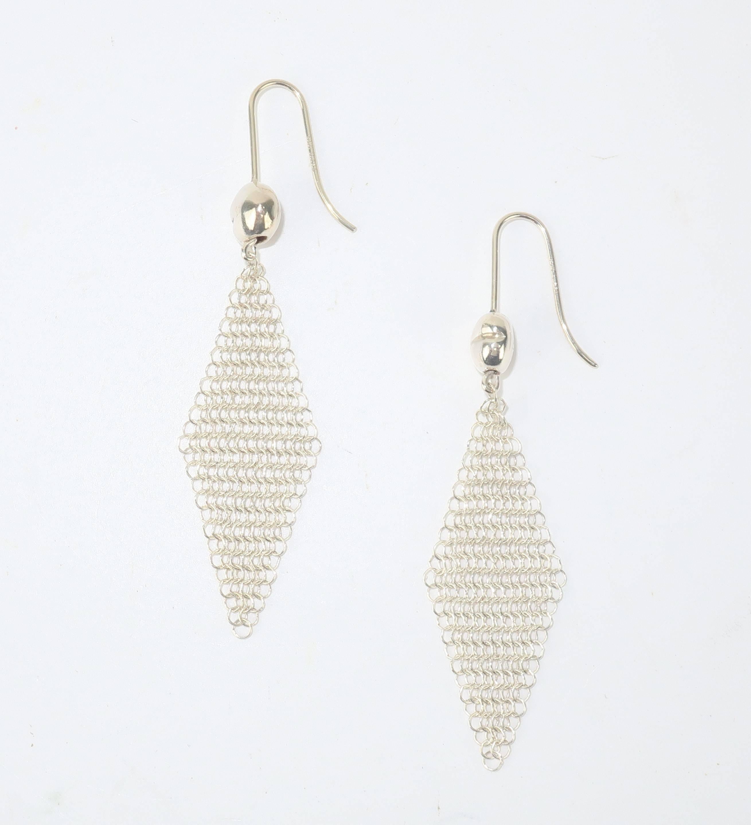 Elsa Peretti’s jewelry designs are as striking as the lady herself.  Her unique pieces for Tiffany & Co. are an artistic combination of organic forms and sculpture.  These 2” long sterling silver ‘mini’ mesh earrings have an iconic Peretti bean