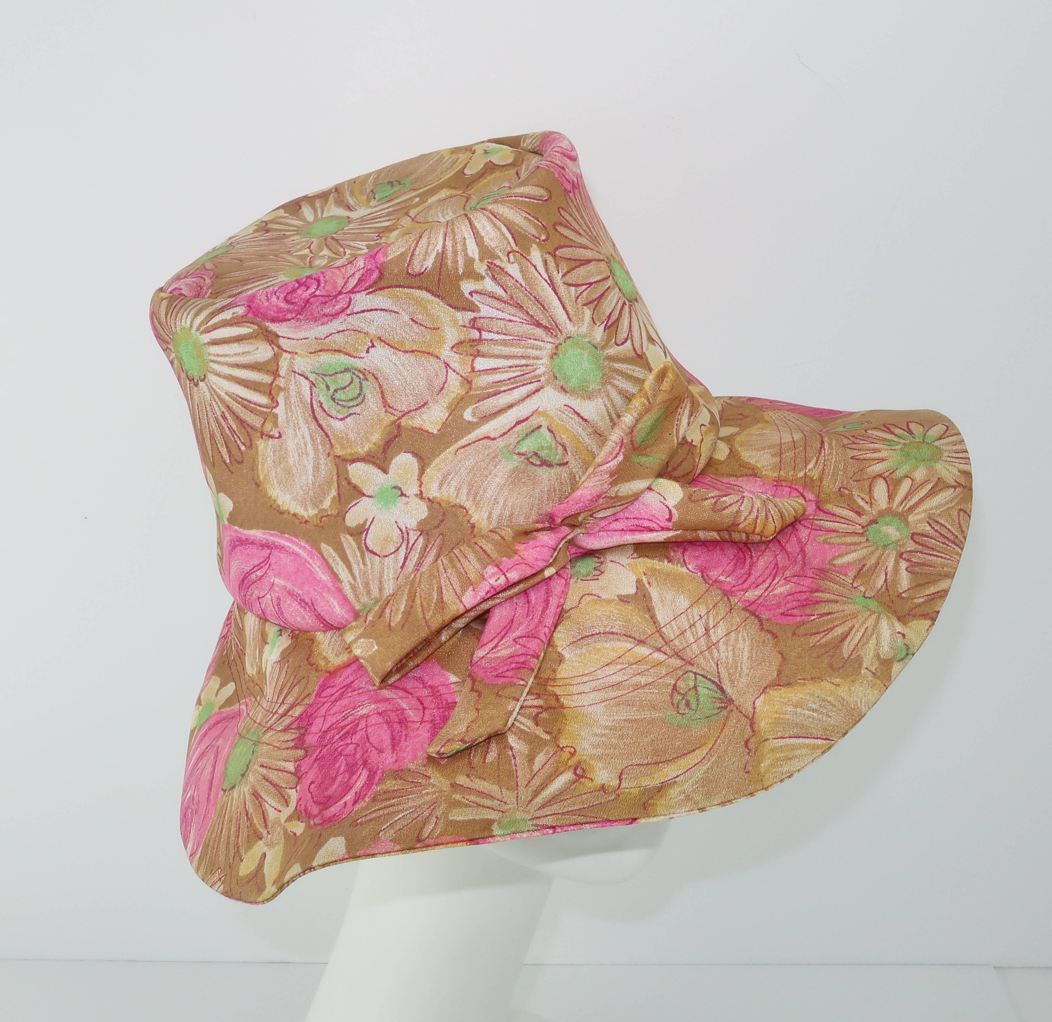 Fun and floppy with a purpose!  This 1960's hat from Claire Ann of Flushing, NY has the hidden secret of structure which gives the floppy design a stylized silhouette reminiscent of fashion shoots from the era picturing models in fields of daisies. 