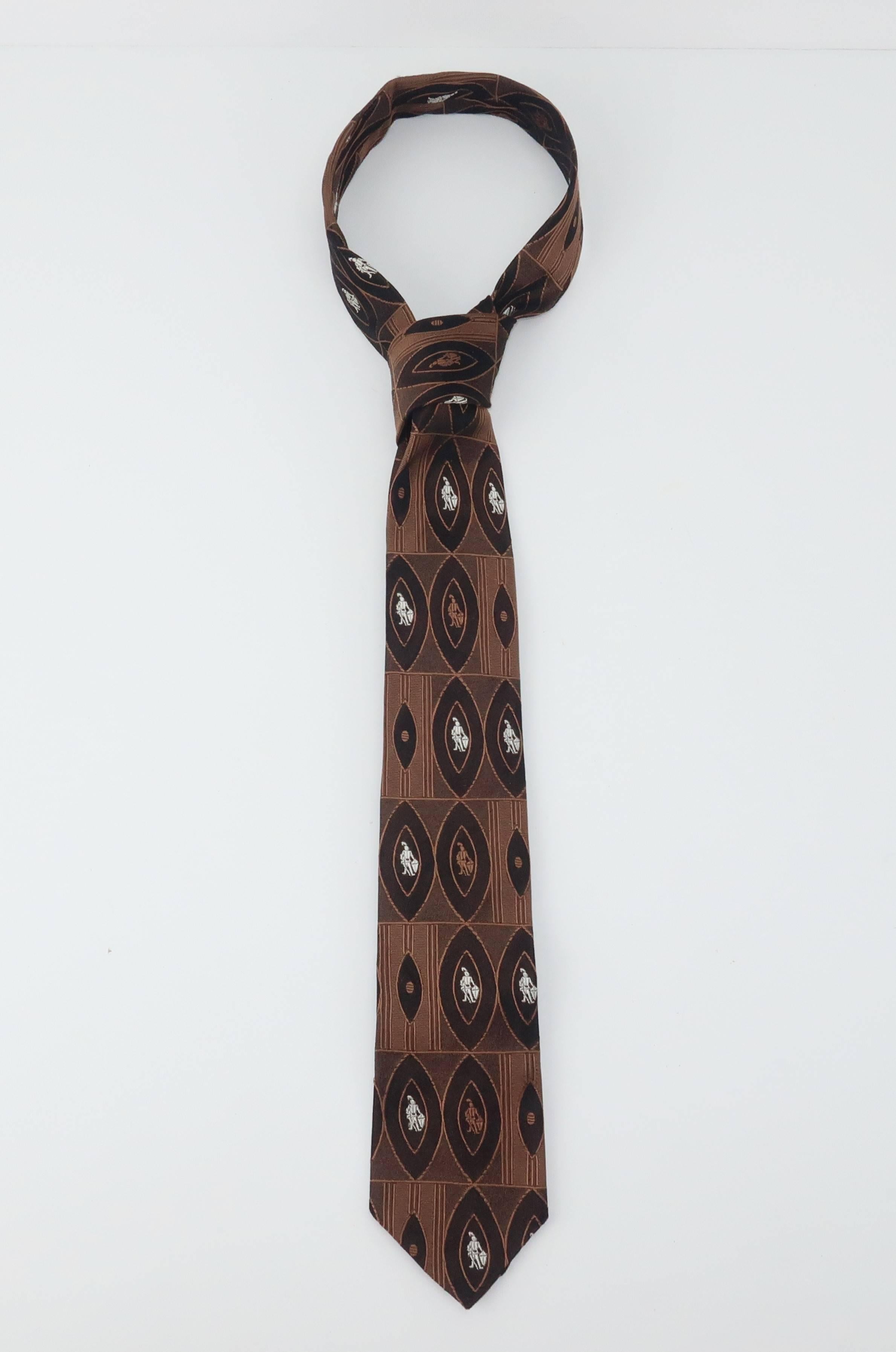 Skinny neckties became the rage in the 1950’s.  This chocolate brown silk tie by Arrow sports a graphic pattern serving as frames for knights in suits of armor ... think of it as the masculine version of a cameo. The ‘skinny’ look is great for the