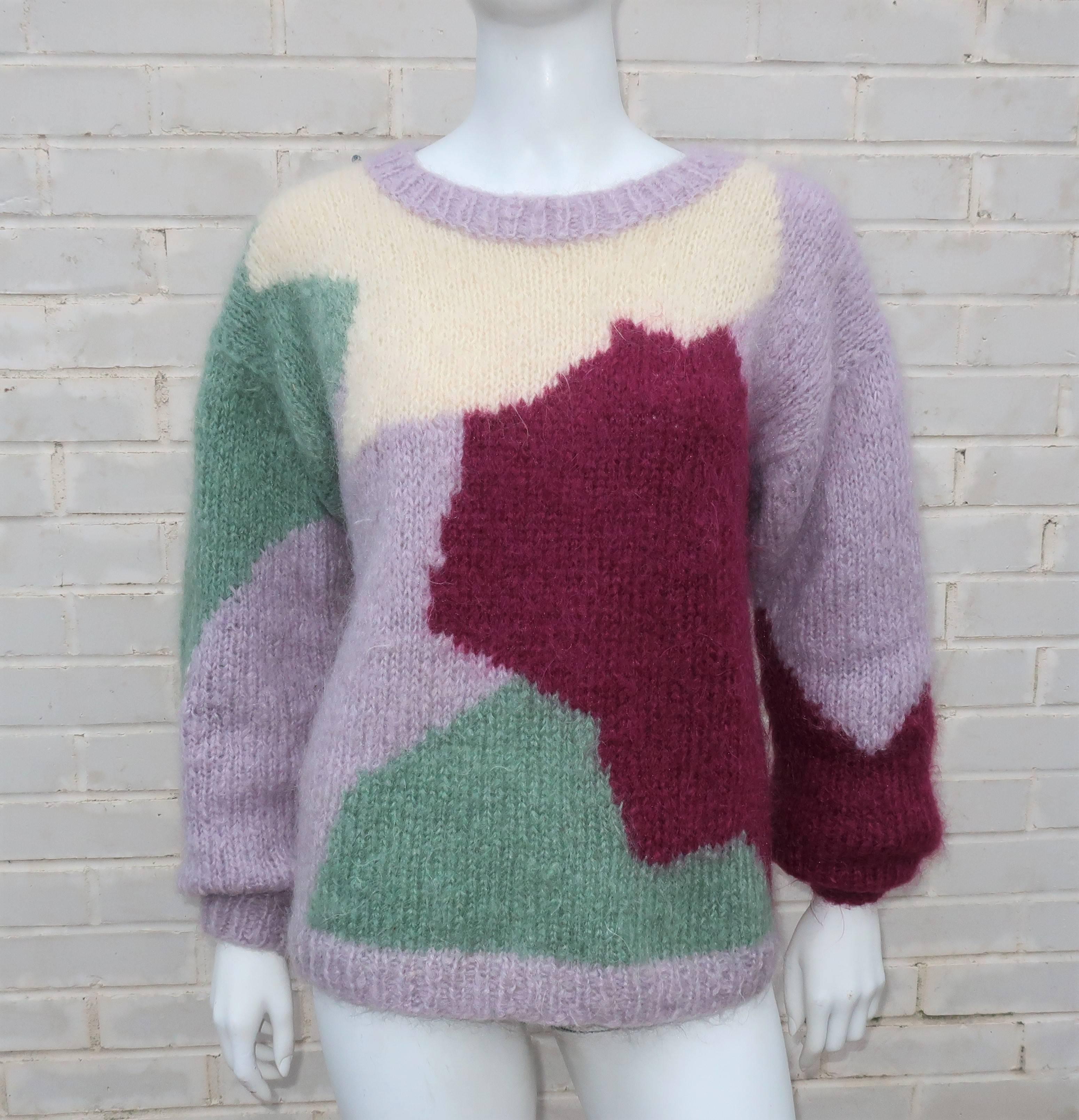This pullover 1980's 'boyfriend' style sweater is fabricated from a color blocked pattern of mohair in plum, lavender, sage green and creamy white.  Perfect cozy silhouette to pair with jeans.  Excellent vintage condition.
SIZING &