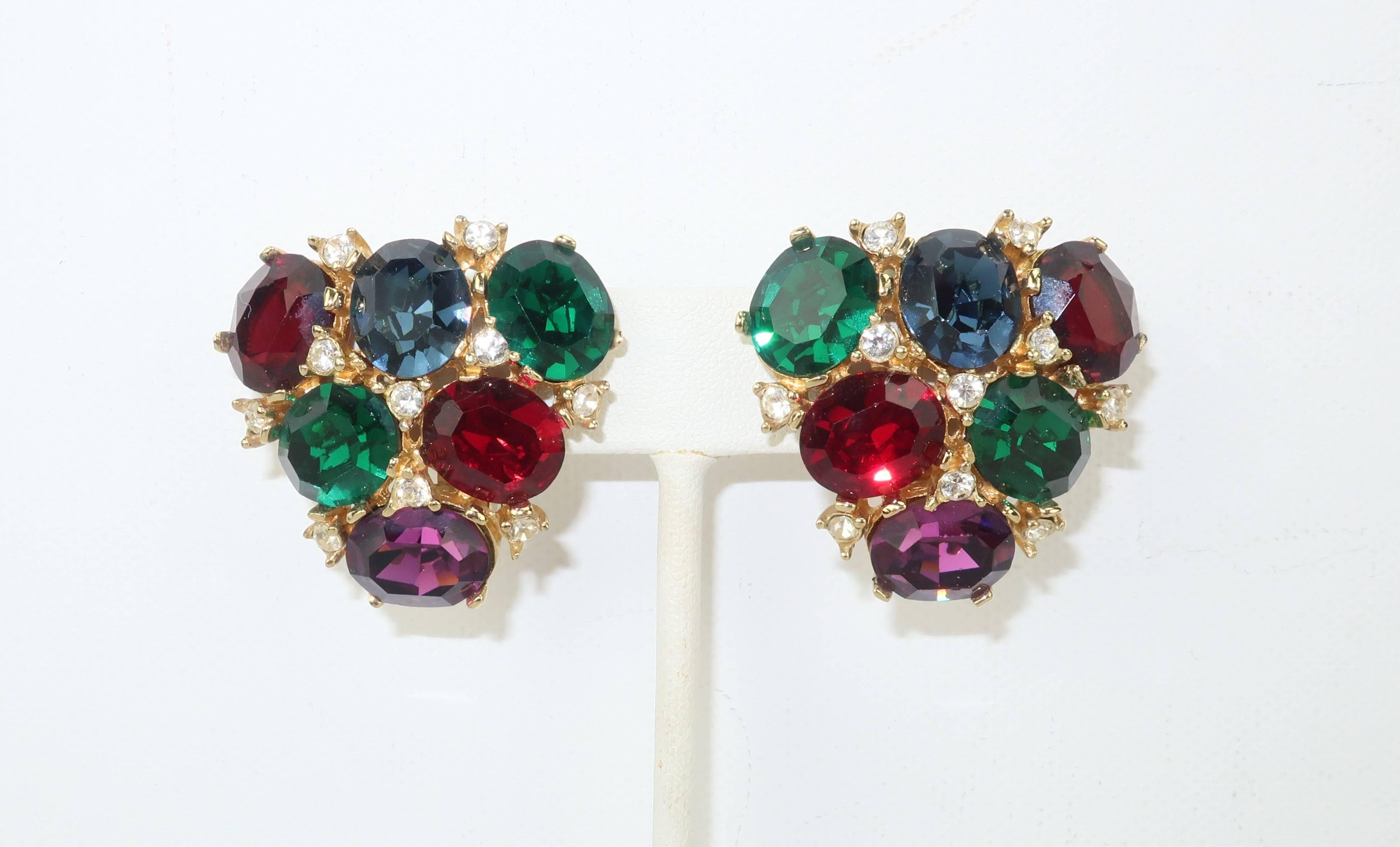 Glorious glamour alert! These clip on earrings are by Ciner, an American costume jewelry company known for producing high quality accessories since the 1930's.  The inverted gilt metal triangular shape is constructed of multi-color crystal