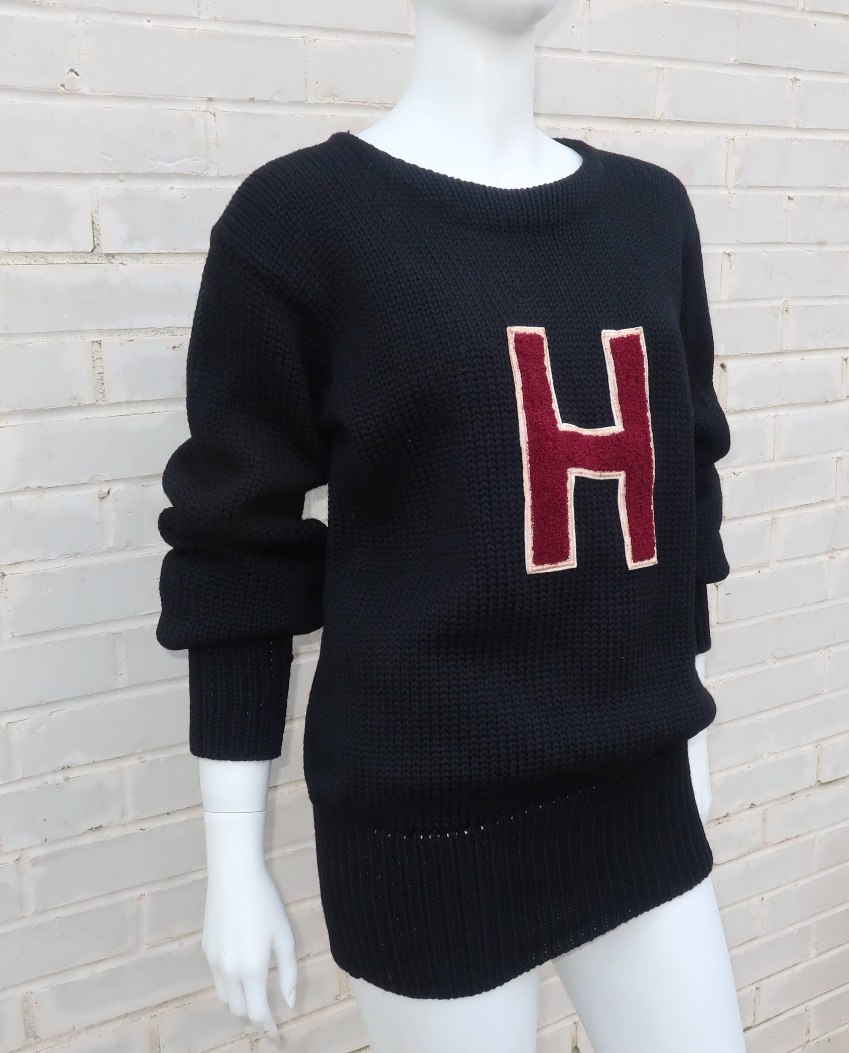 Get that old school collegiate look with this unisex 1960's Harvard letterman sweater originally sold from famed sporting goods store, Holovak & Coughlin.  The chunky cable knit appears to be a wool blend with a comfortable boat neck and ribbed