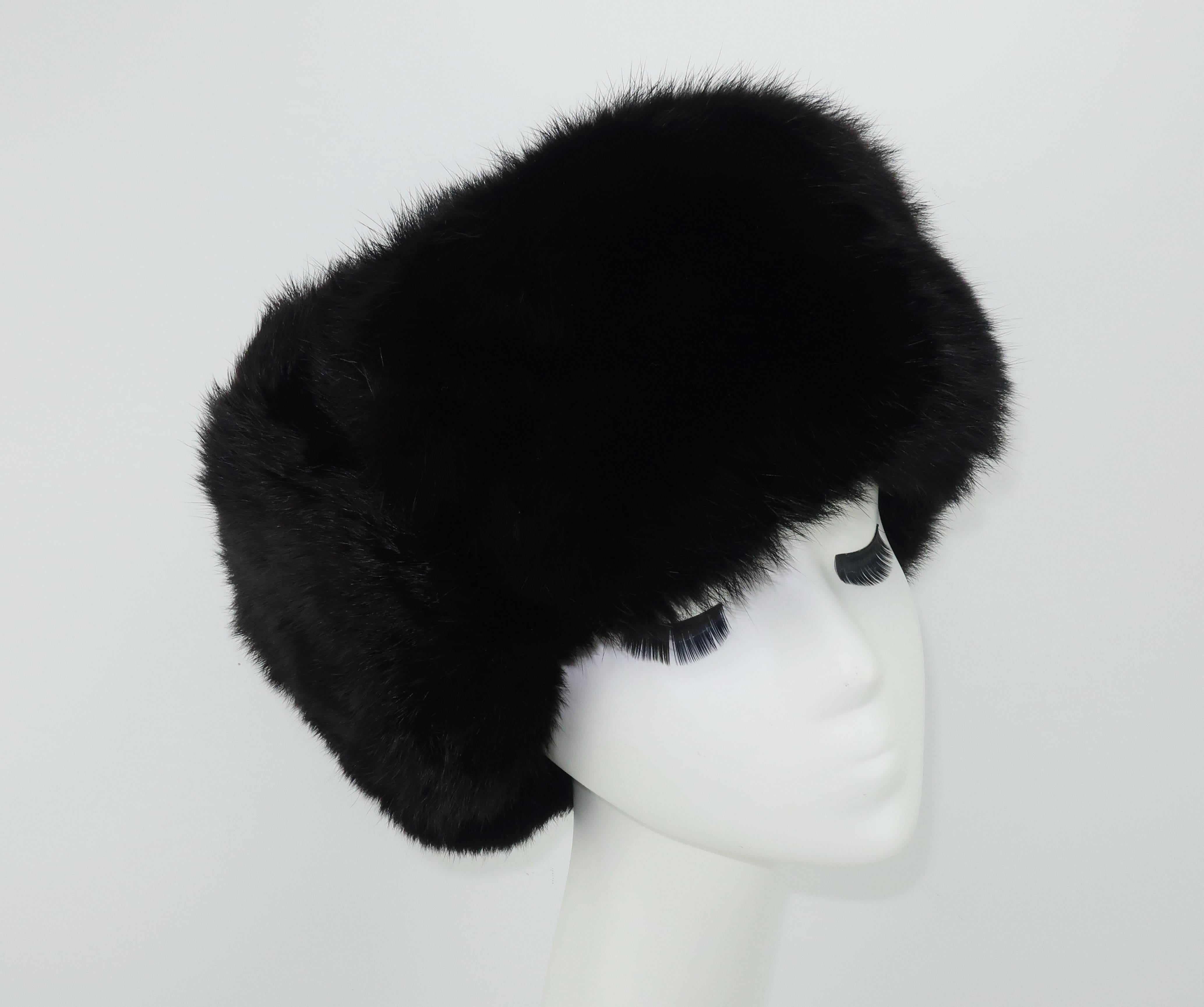 From Russia with love!  A Bond girl would be happy to wear this practical and yet oh so stylish Russian sable fur trapper's hat.  The lush sable is a deep dark brown that almost appears black and it is shaped into a traditional form that can be worn