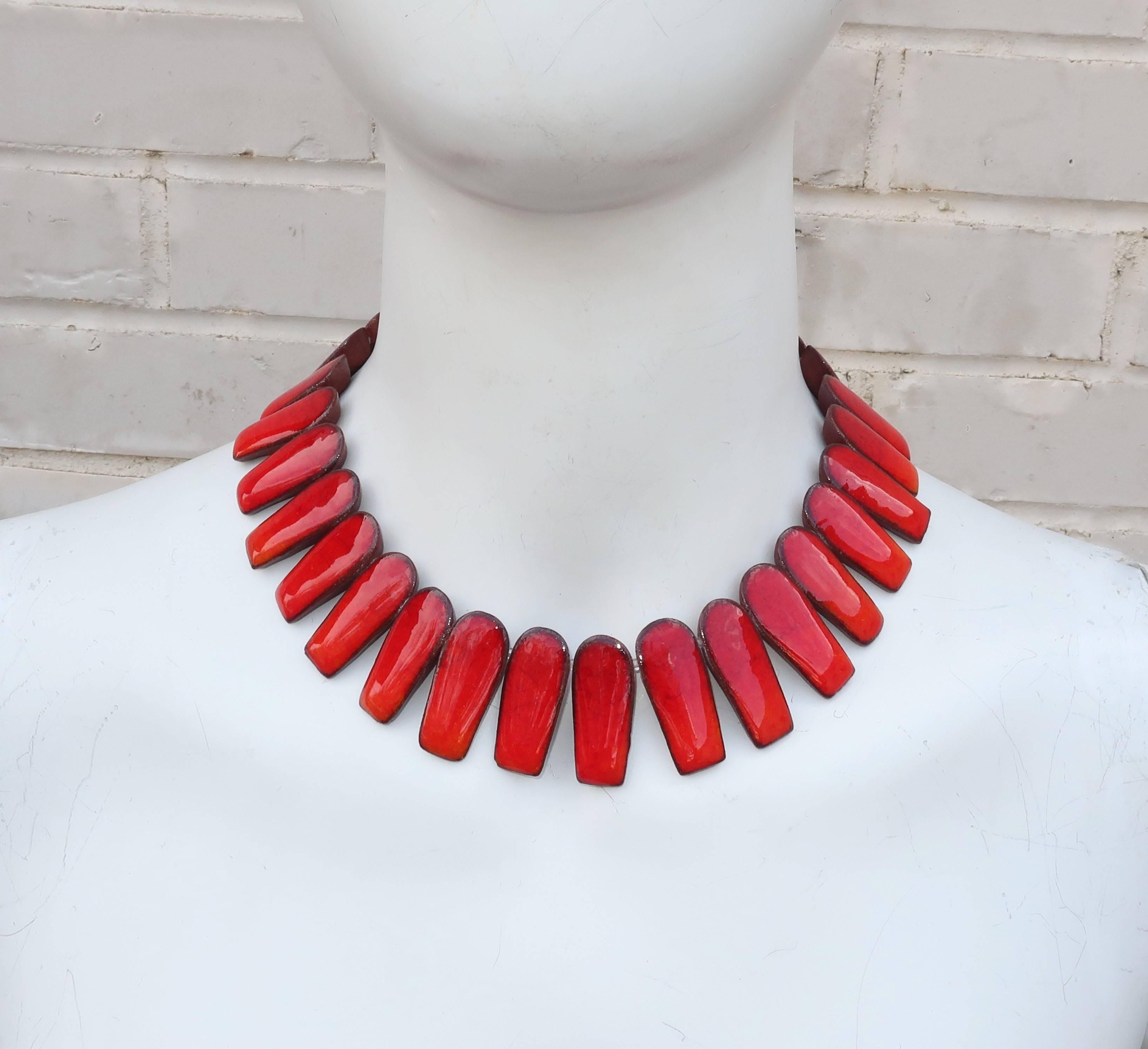 This stunning art pottery necklace by Brondsted of Denmark combines the vibrancy of artisan design and modernist costume jewelry.  Amazingly, each link of this exotic collar necklace is a piece of pottery bearing a fiery glaze with decoration that