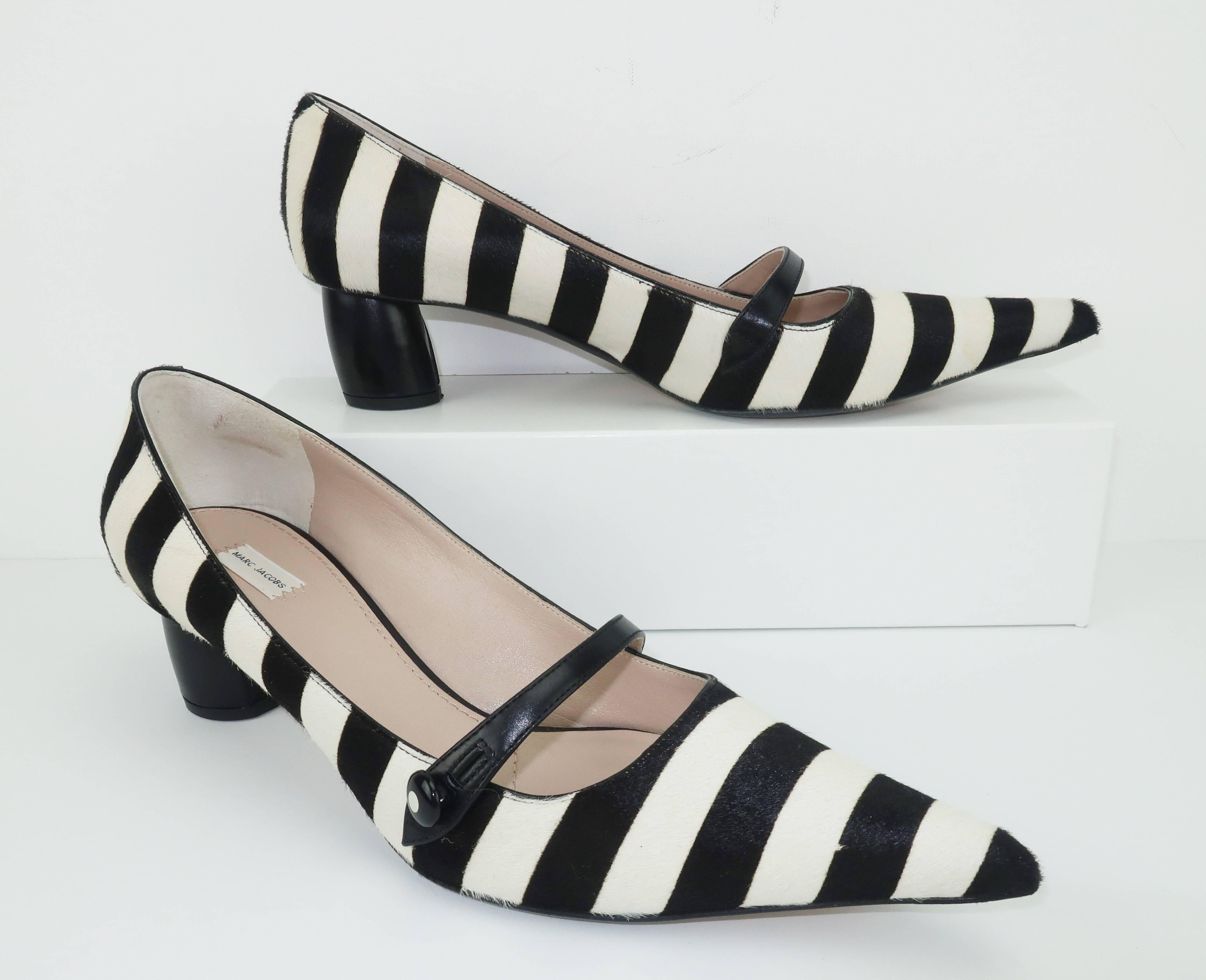 These contemporary Marc Jacobs shoes are a fabulous ‘witchiepoo’ Mary Jane silhouette with exaggerated pointy toes.  Fabricated from black and white striped pony with black calf straps and covered cylindrical kitten heel which measures a 