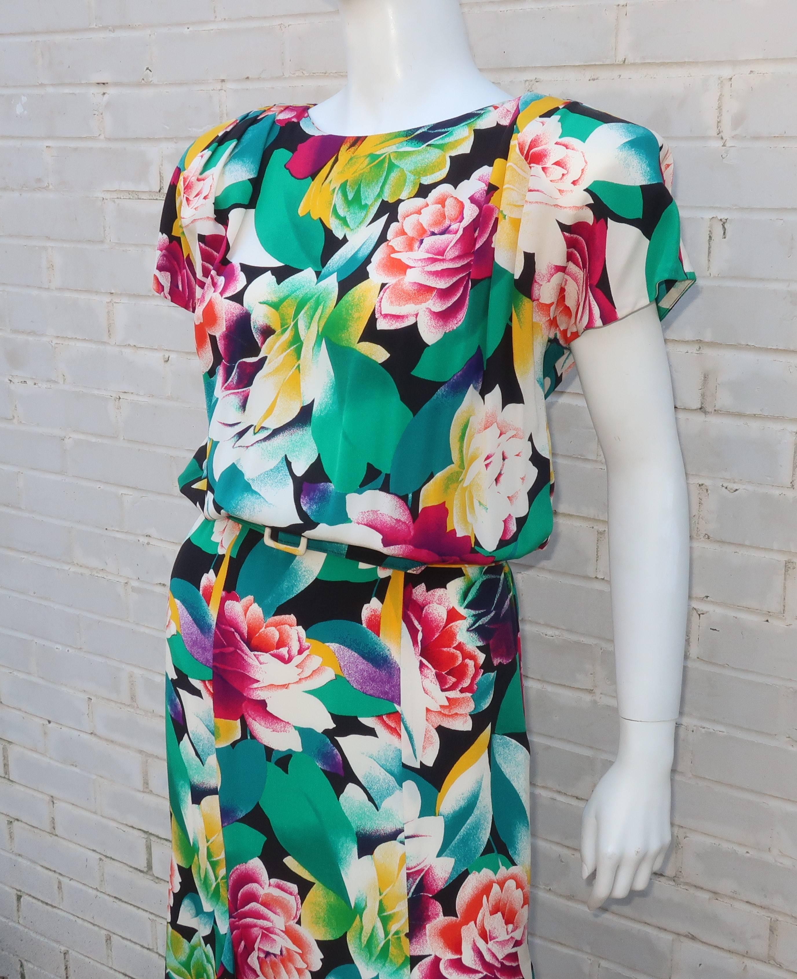 This Pearl & Albert Nipon design from the 1980's conjures up images of a 1940's tropical locale.  The silk dress zips, hooks and snaps at the side with fabric covered buttons romantically running up the back bodice.  The colorful tropical silk