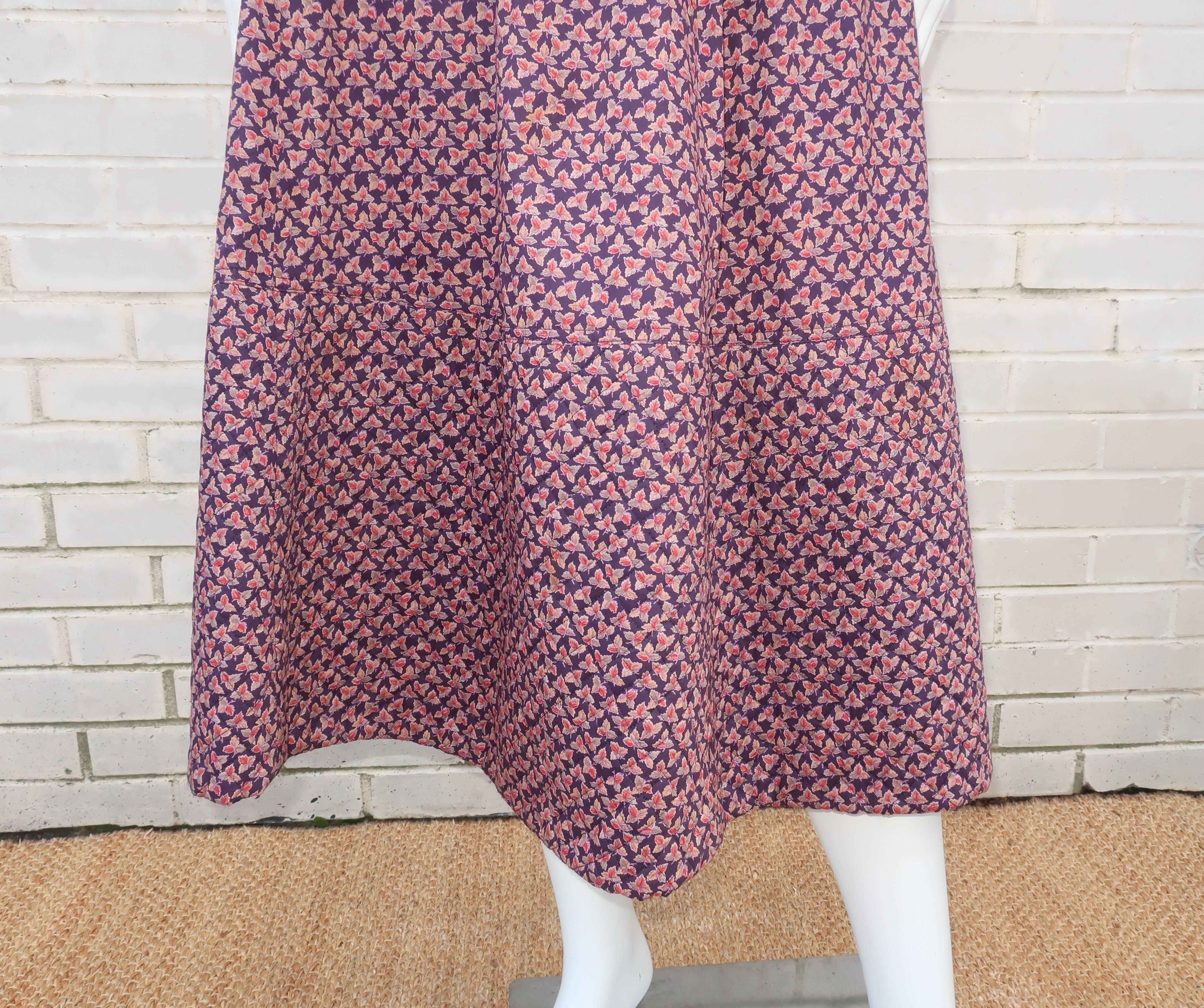 Jaeger has been making classic clothing since the turn of the 20th century.  This 1970's period perfect peasant skirt is fabricated from a lightweight cotton leaf print in shades of deep plum, mauve and a pinkish red.  It buttons and zips at the