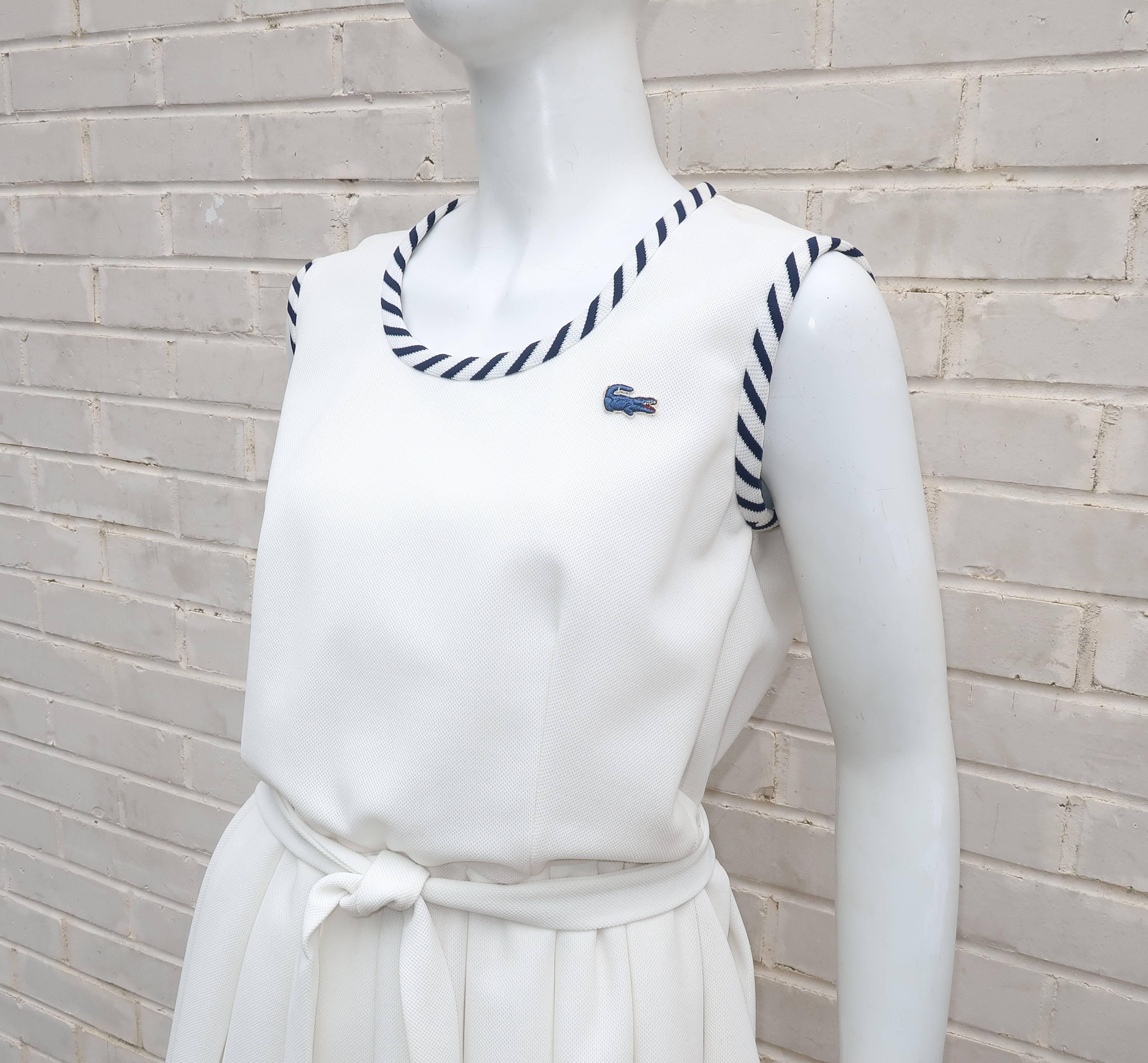 Tennis anyone?  Well it is 'love' at first sight with this 1970's Izod tennis dress complete with the iconic alligator made famous by Rene Lacoste and sold in the United States by sportswear maker, David Crystal.  The sleeveless white polyester