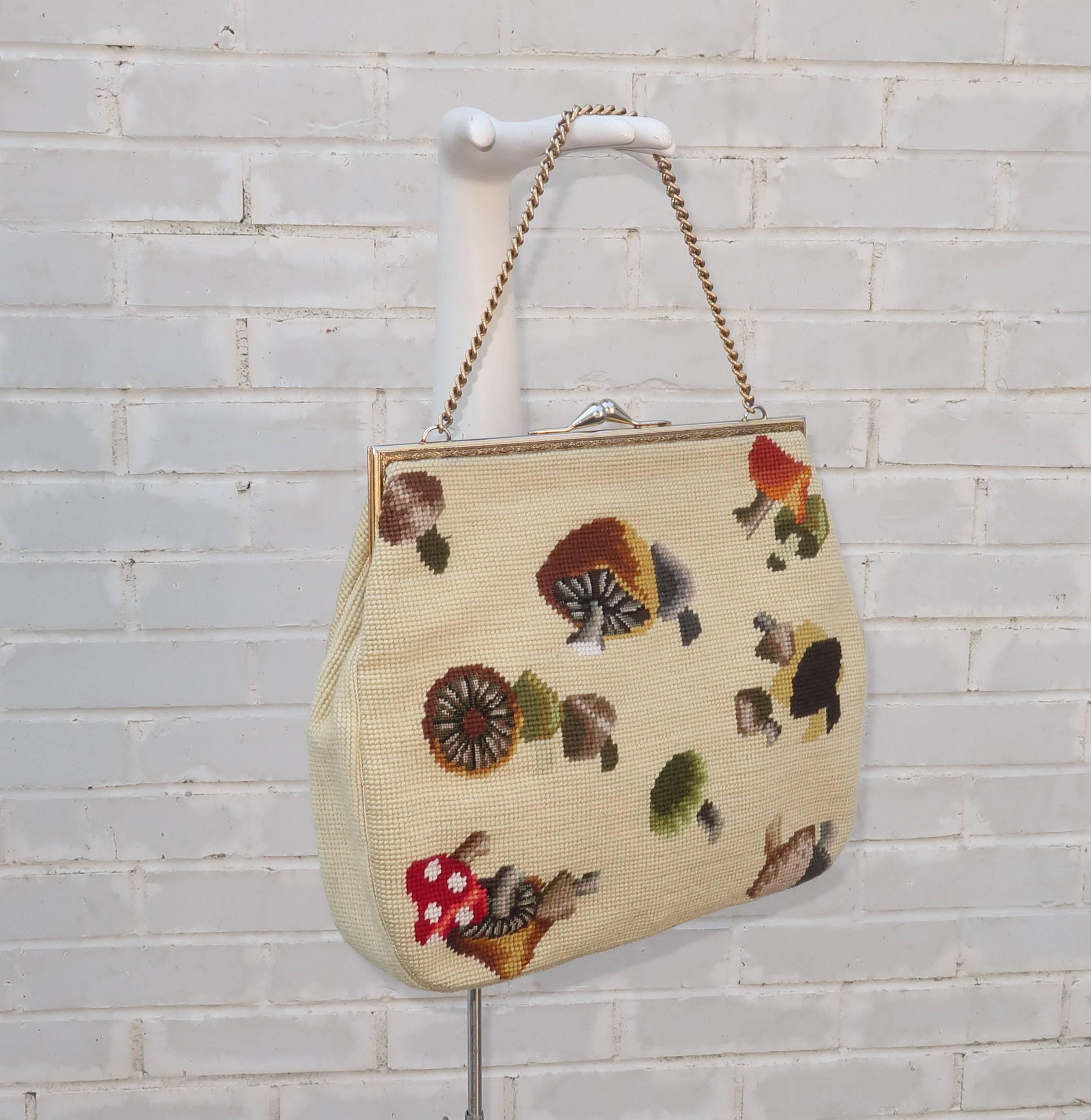 Not all 'granny bags' are created equal!  This C.1960 needlepoint example is at the front of the pack combining an extra large size with a delightful mushroom motif.  The body of the handbag measures 13.5