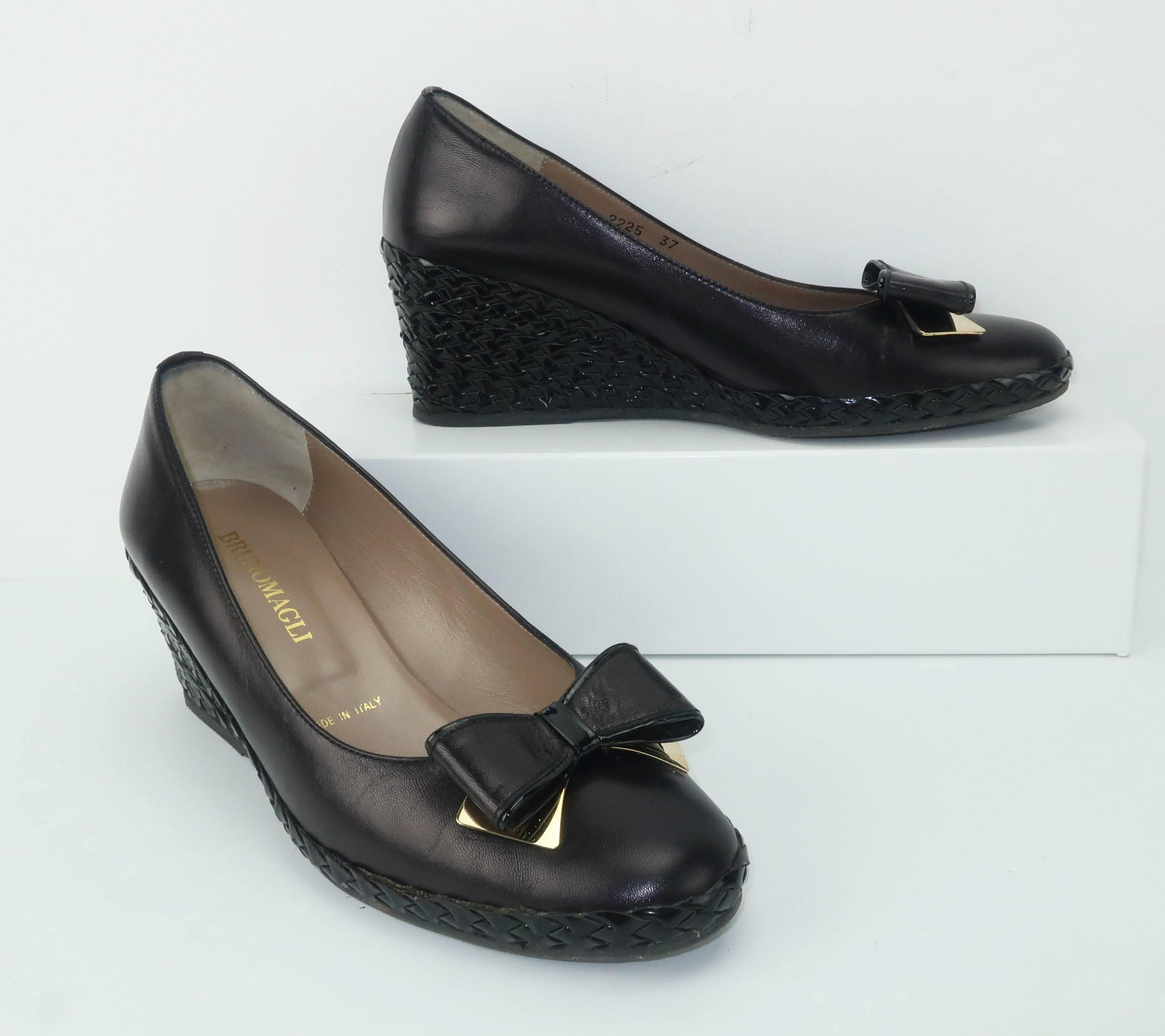 Bruno Magli has been producing quality Italian leather goods since 1936.  These comfortable black leather shoes have an espadrille style patent woven 2.5