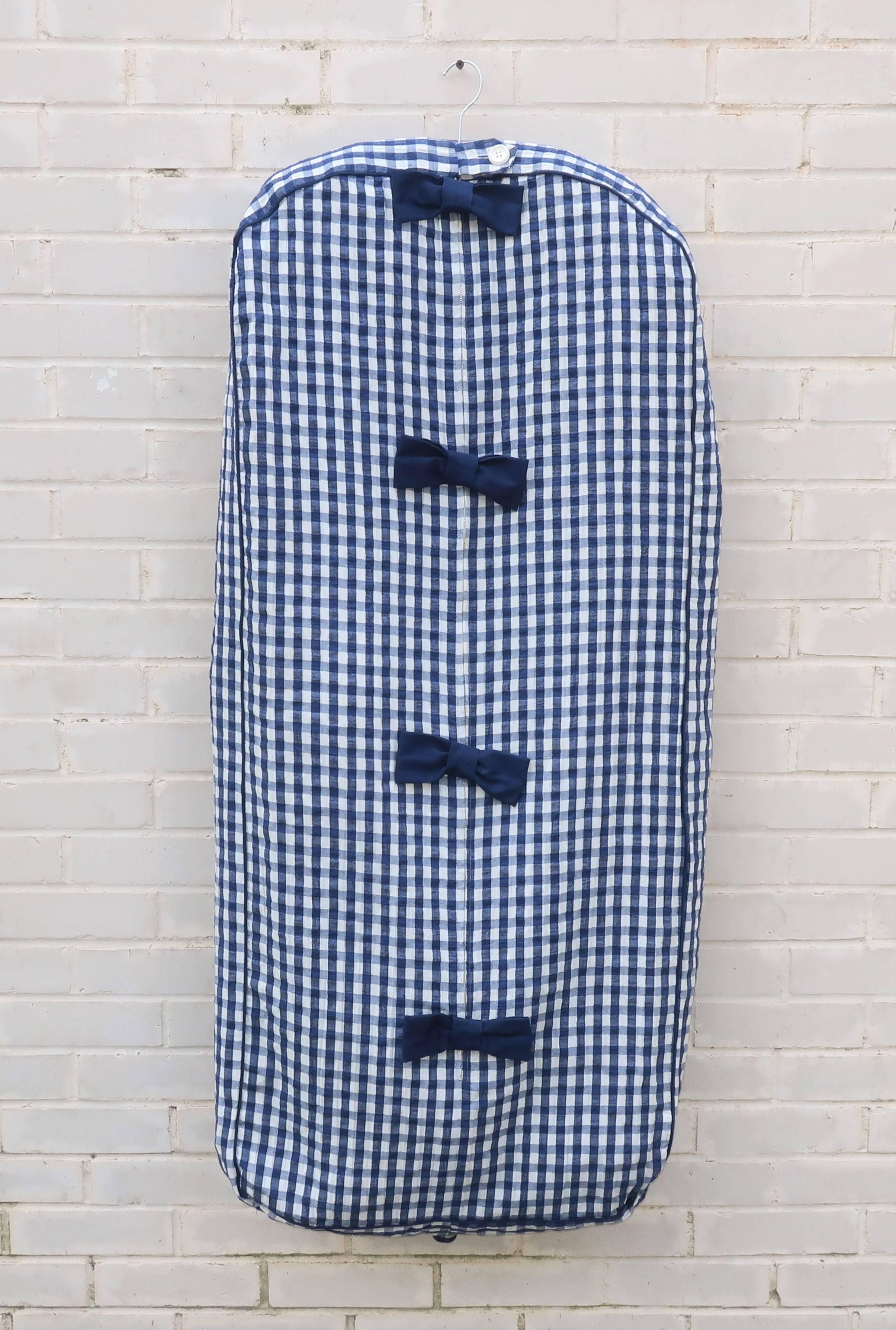 Looking for a weekender?  This 1960's Tannerway garment bag is the perfect preppy alternative to modern day luggage.  The breathable and, oh so adorable, blue and white gingham seersucker cotton fabric looks like Summer and can easily tote a handful