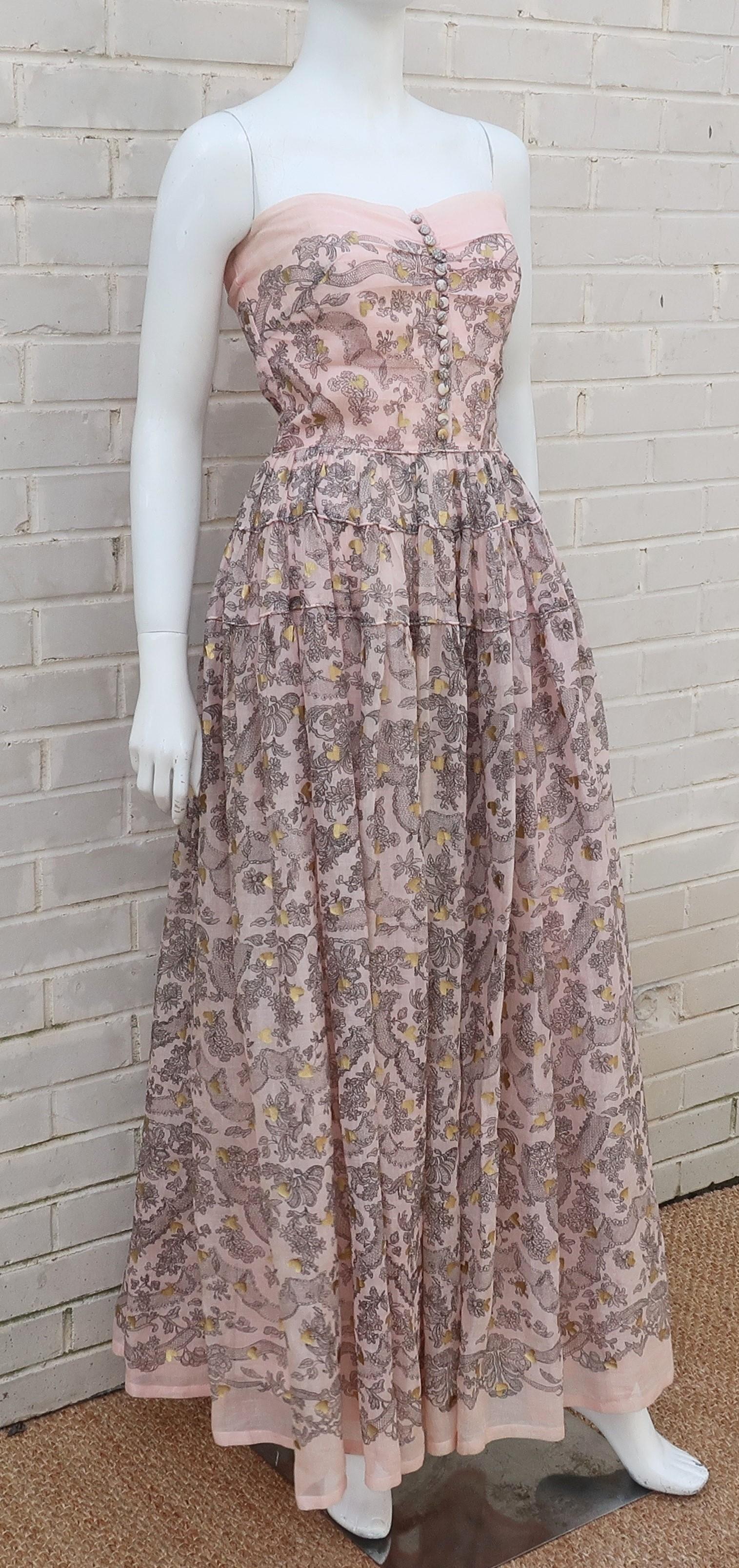 This 1950's Fred Perlberg 'Dance Originals' evening gown is loaded with charm and an expert blending of a casual fabric with a formal silhouette that is contemporary and modern, as if it was fresh off today's runways.  The semi-transparent cotton