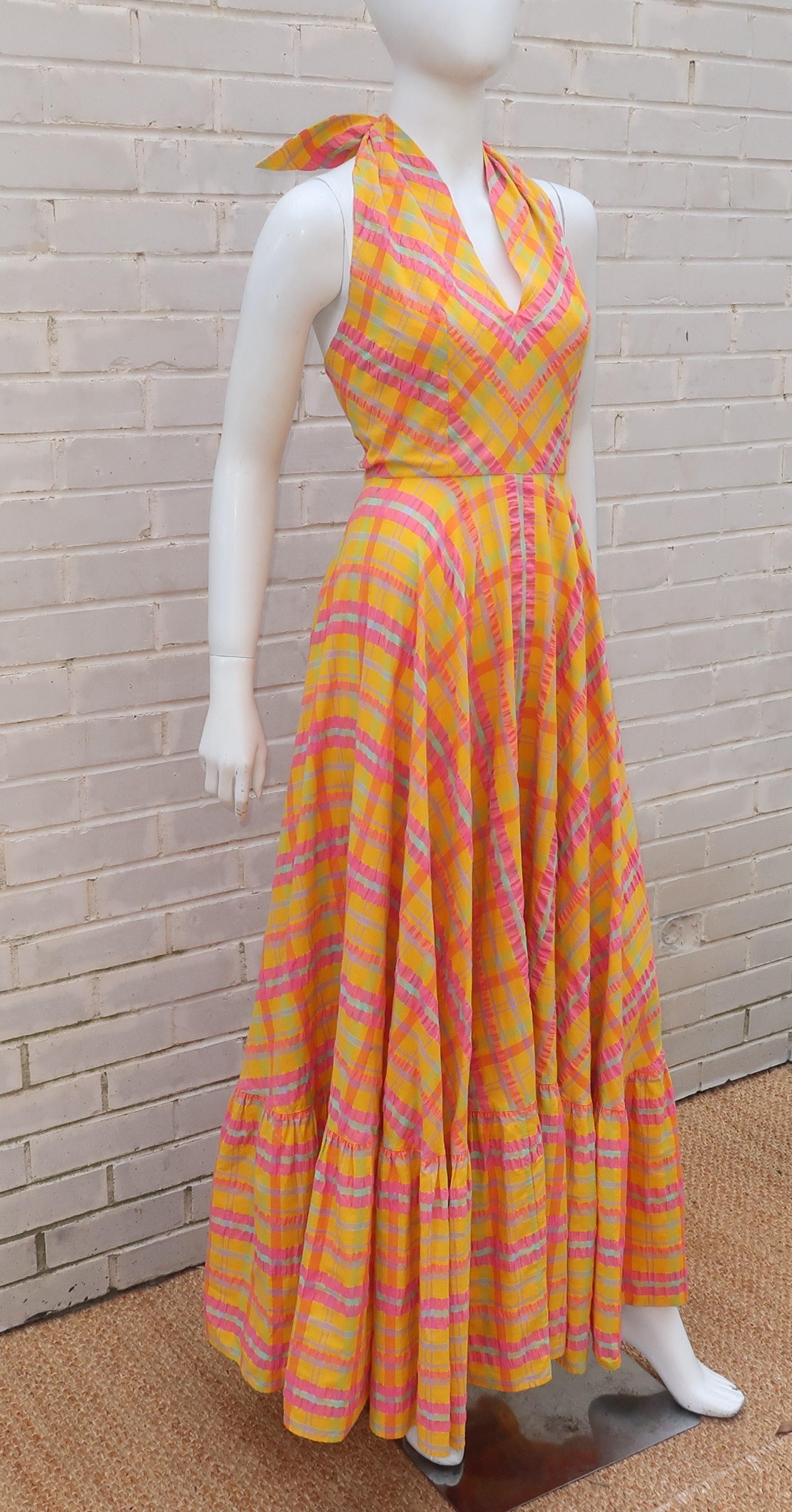 This 1960's Dior Boutique dress for Saks FIfth Avenue is a breath of fresh air in a splash of sunny colors including yellow, orange, pale green, lavender and watermelon pink.  The cotton seersucker plaid fabric is the perfect foil for the peasant