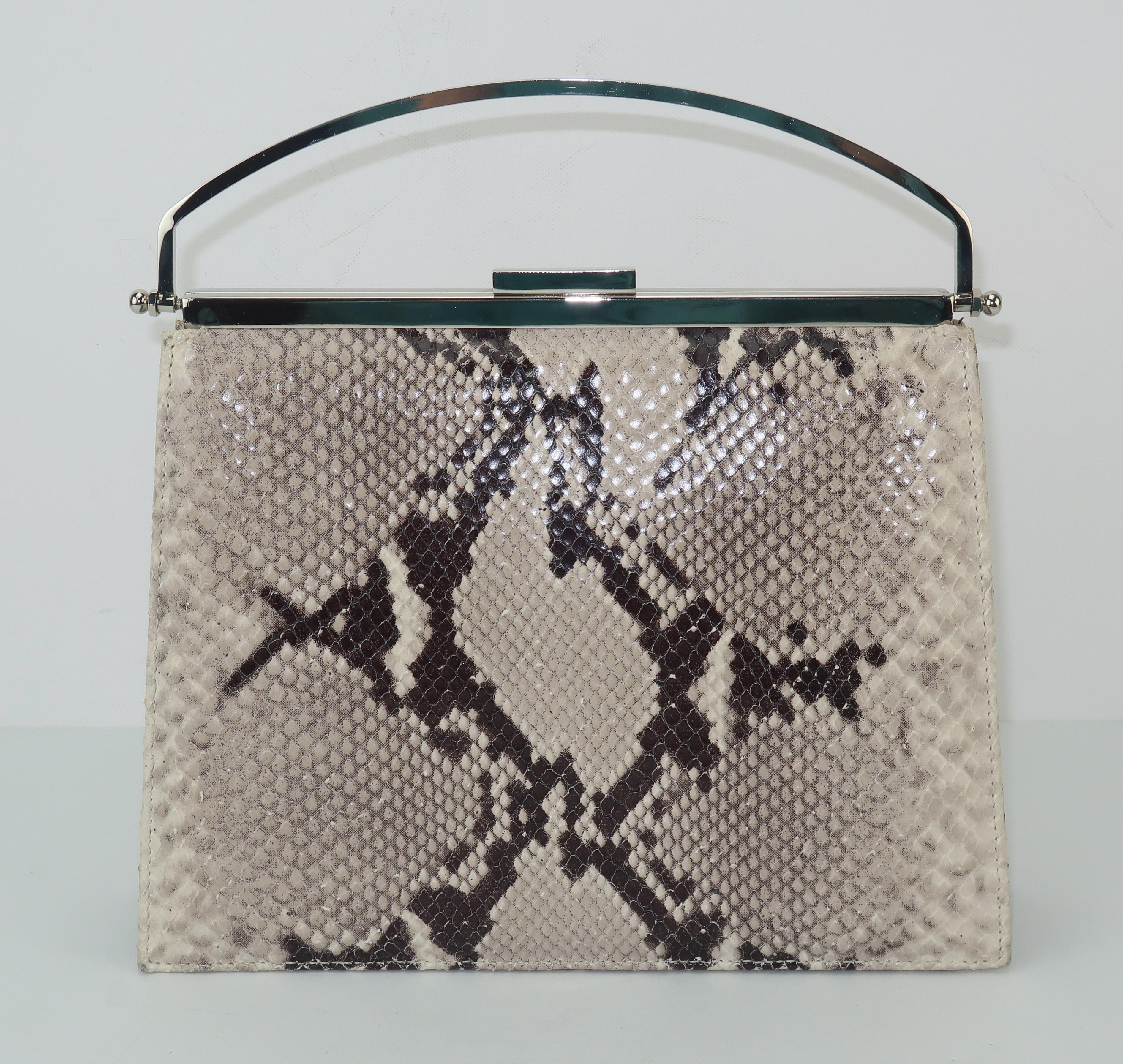 Get the python look with this stylish handbag created under the Neiman Marcus label.  The 1980’s design pays homage to the ladylike handbags of the 1950’s with a diminutive size and a top handle silhouette.  The modern twist is the combination of an