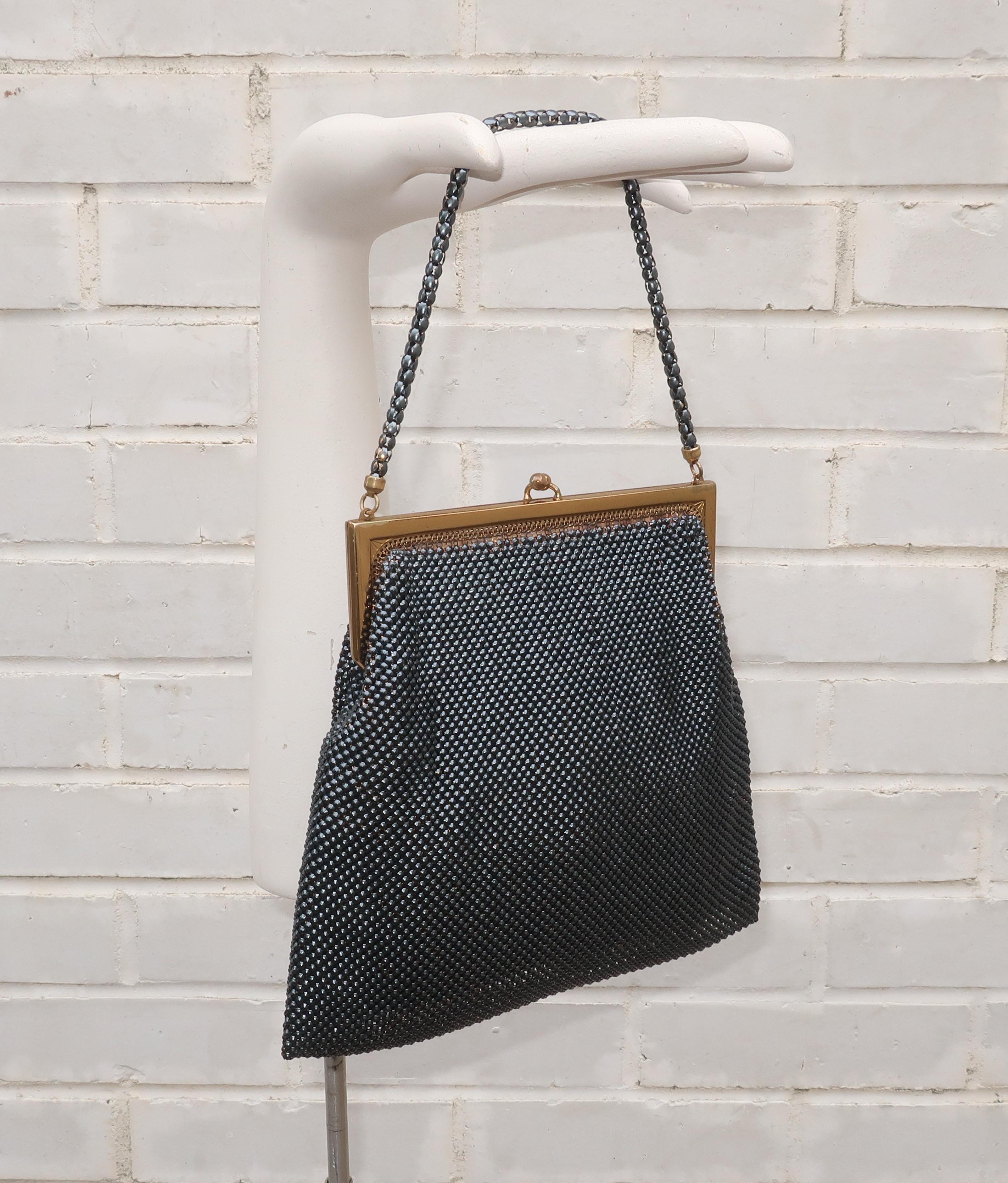 This glamorous black mesh evening handbag by Whiting & Davis will take you from deco to disco! Whiting & Davis has been producing fashionable handbags since the late 1800’s and their signature mesh designs represent classic American glamour.  The
