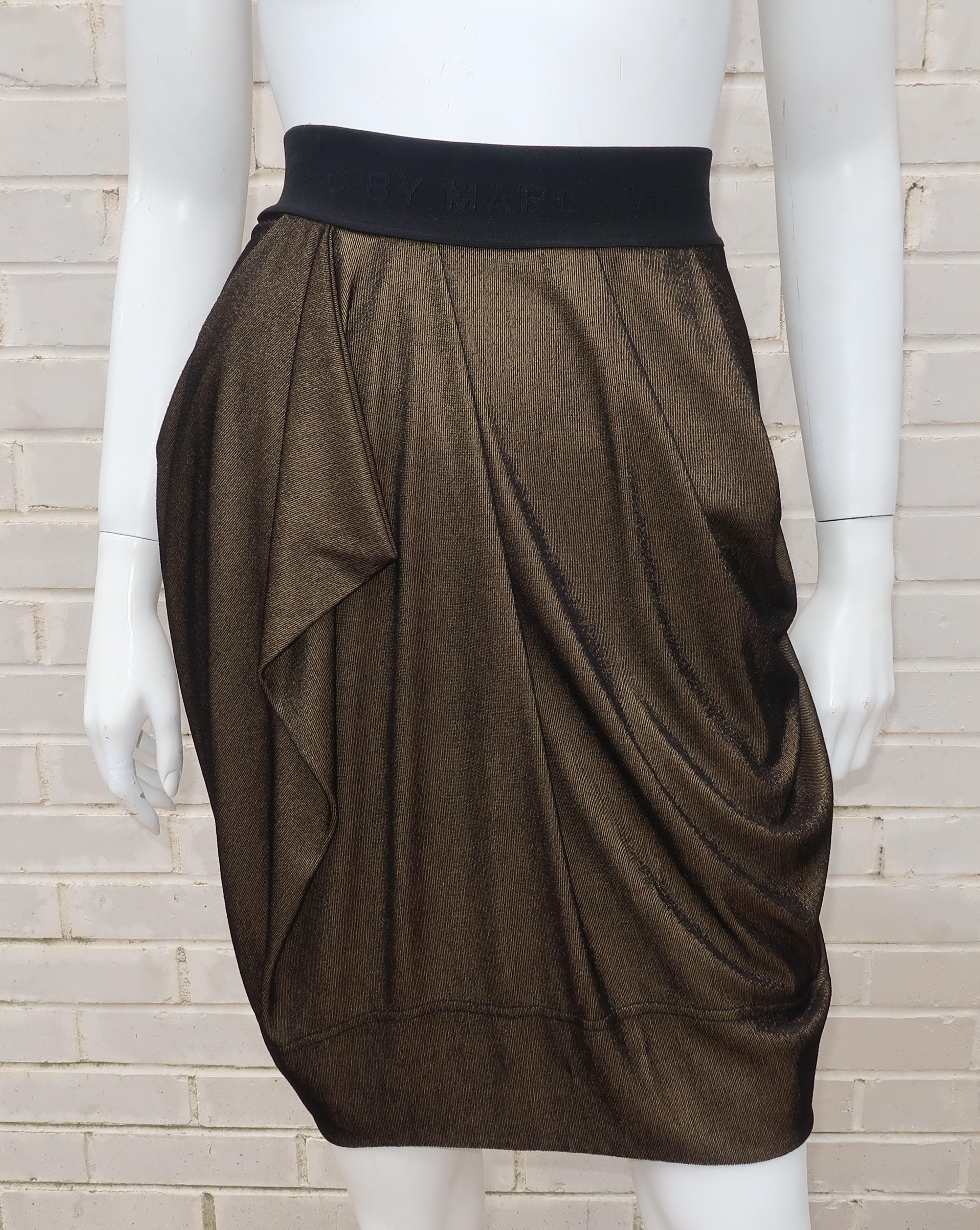 This Marc by Marc Jacobs skirt is like a fashionable take on boxing satins with a good dose of goddess style draping.  The wide black elastic waistband is imprinted with the Marc Jacobs logo and features a prominent gold zipper with a grosgrain pull