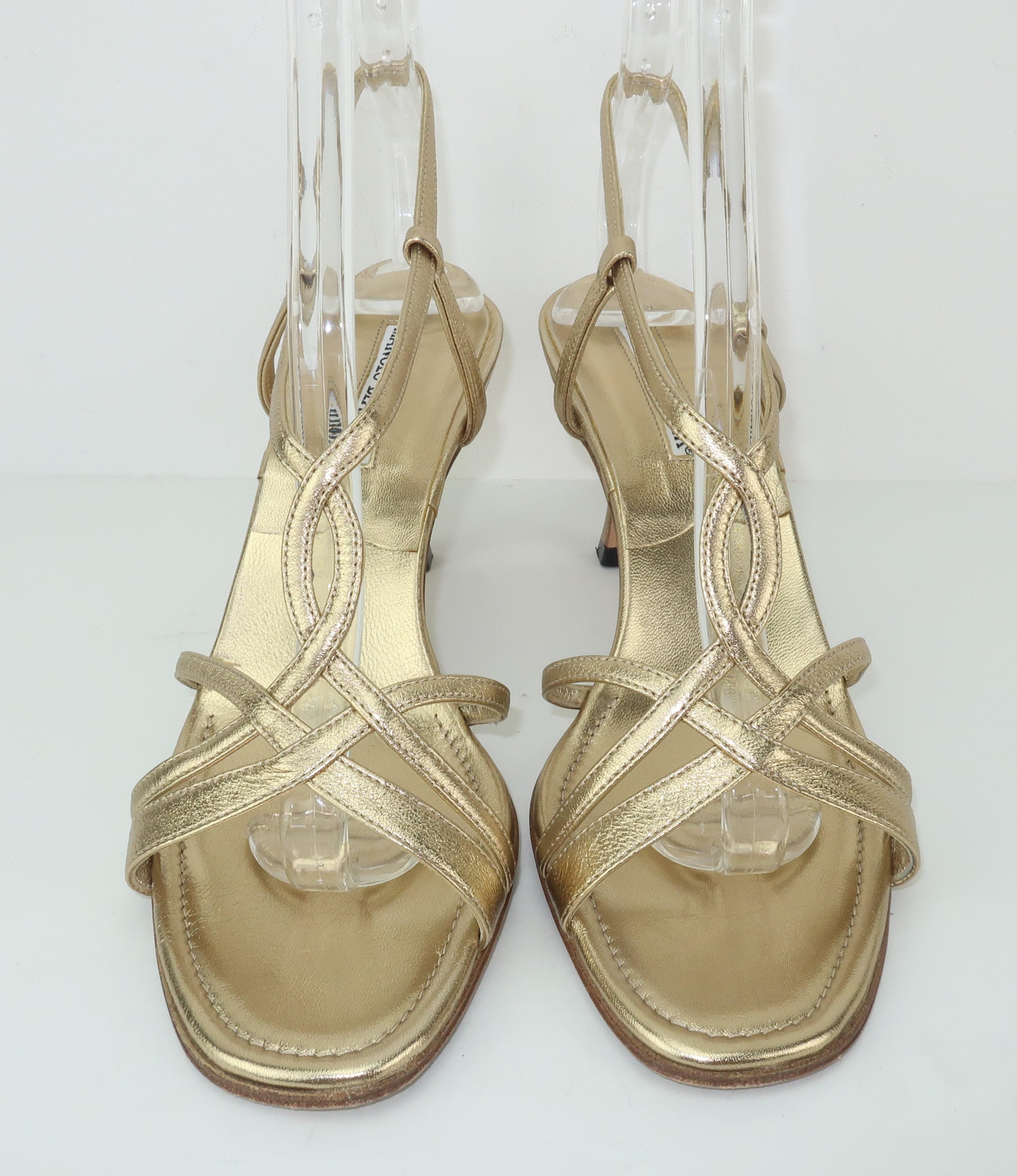 A Blahnik basic!  This strappy gold leather sandal by Manolo Blahnik combines a classic evening wear look with a stylishly simple design that will prove to be a 'go to' shoe for many occasions.  The comfortable 3