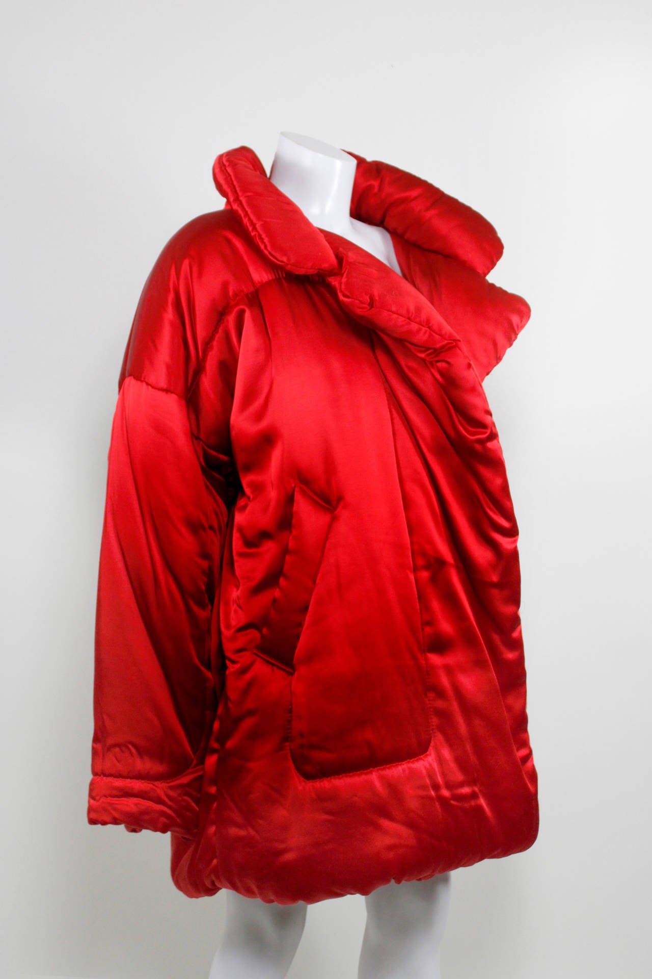This fabulous jacket is the iconic Norma Kamali sleeping bag car coat. Made with a special blend of rayon and acetate, the finish resembles a luxurious satin.