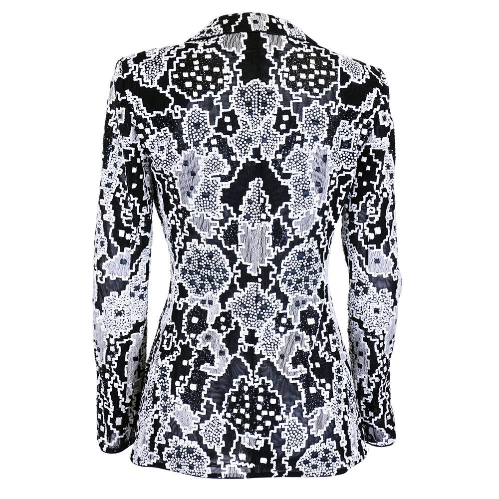 This is a gorgeous tailored jacket from Giorgio Armani, featuring a bold graphic print done in white sequins against black organza.

-Snap closure
-Slightly padded shoulders

Measurements--
Bust: 36 inches
Waist: 28 inches
Length, Shoulder