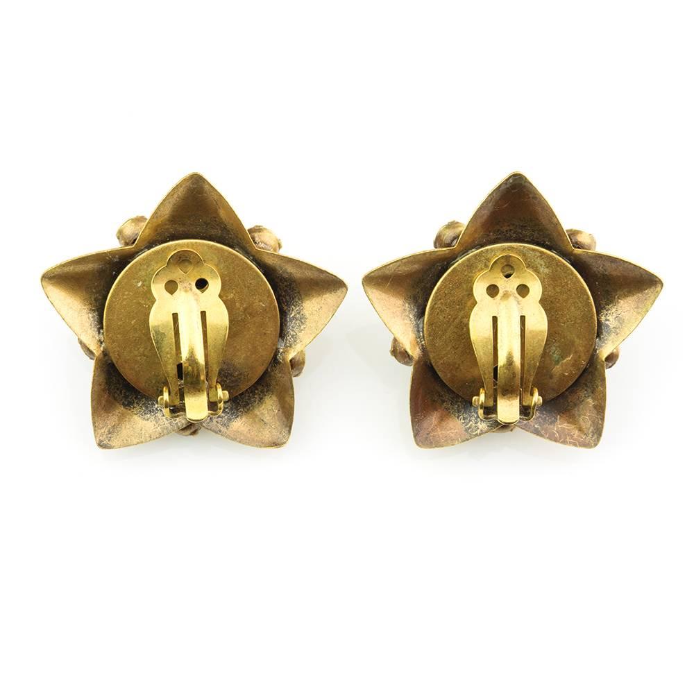 1940s Josef brass tone clip on earrings with multicolor rhinestone accents and dimensional Cupid holding two dangling rhinestones. Whimsical and adorable example of the creative genius of Josef - jeweler to the Golden Age of Hollywood.