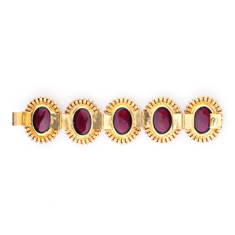 Rare and beautiful 1970s link bracelet by William Delillo with clear red medallions with box clasp