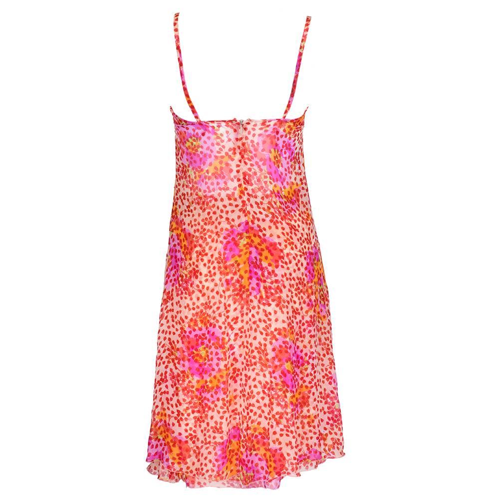 Lightweight spring hued floral print ensemble from the 1990s consisting of an elongated split side tunic and mid length flared skirt. sweet and sexy. Silky chiffon with back zip. Wonderful day to evening piece.