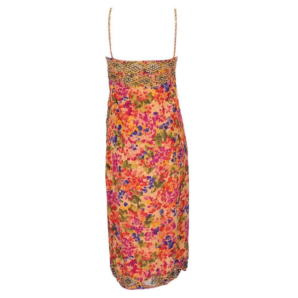 1980s James galanos cocktail dress trimmed with embroidery and beads.  Silk watercolor floral print in autumnal colors. Thin spaghetti straps with wrap front detail. Lovely lightweight summer party dress.