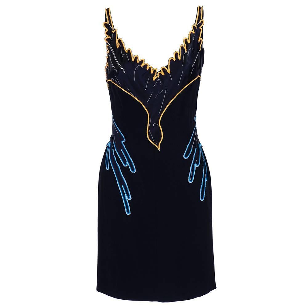 Late 1990s/early 2000s Lanvin body conscious mini dress with multi-colored appliqued and embroidered wing motif wrapped around torso. New with tags, with original selling price of $5,900. 100% silk with full rayon lining. 