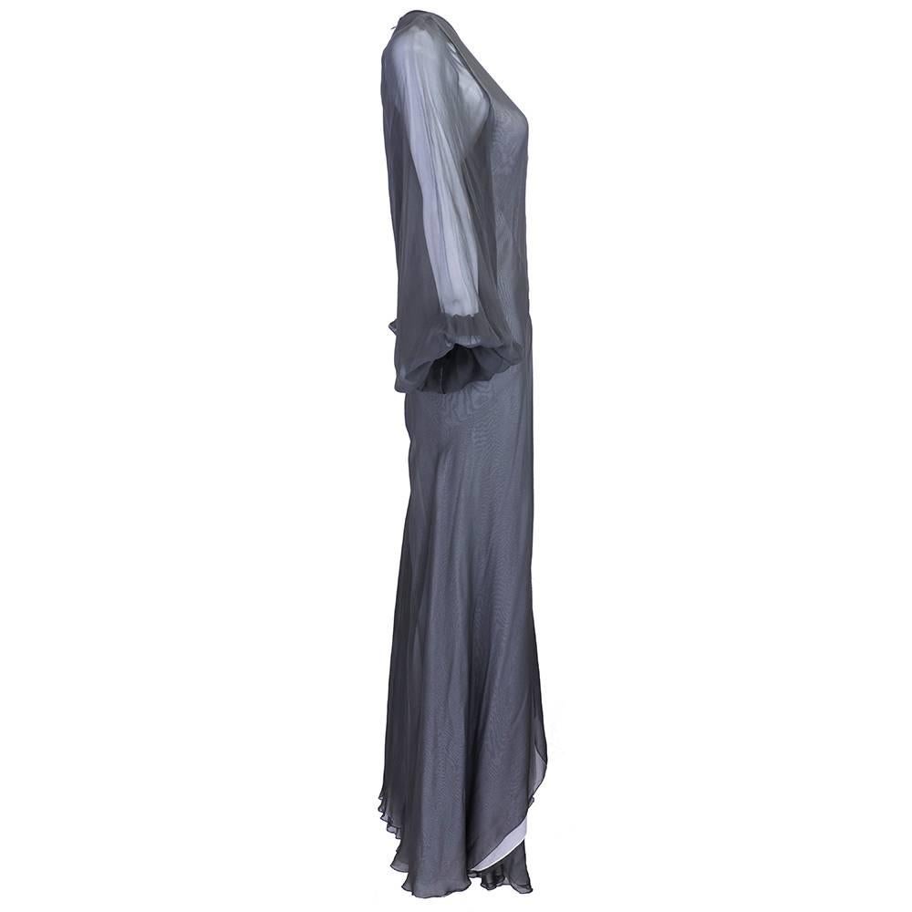 Beautiful goddess piece by one of our favorite designers the Greek Stavropoulos. Jumpsuit in layered chiffon from grey to ivory. Ingeniously cut with full balloon sleeves and wide legs. Matching long scarf.